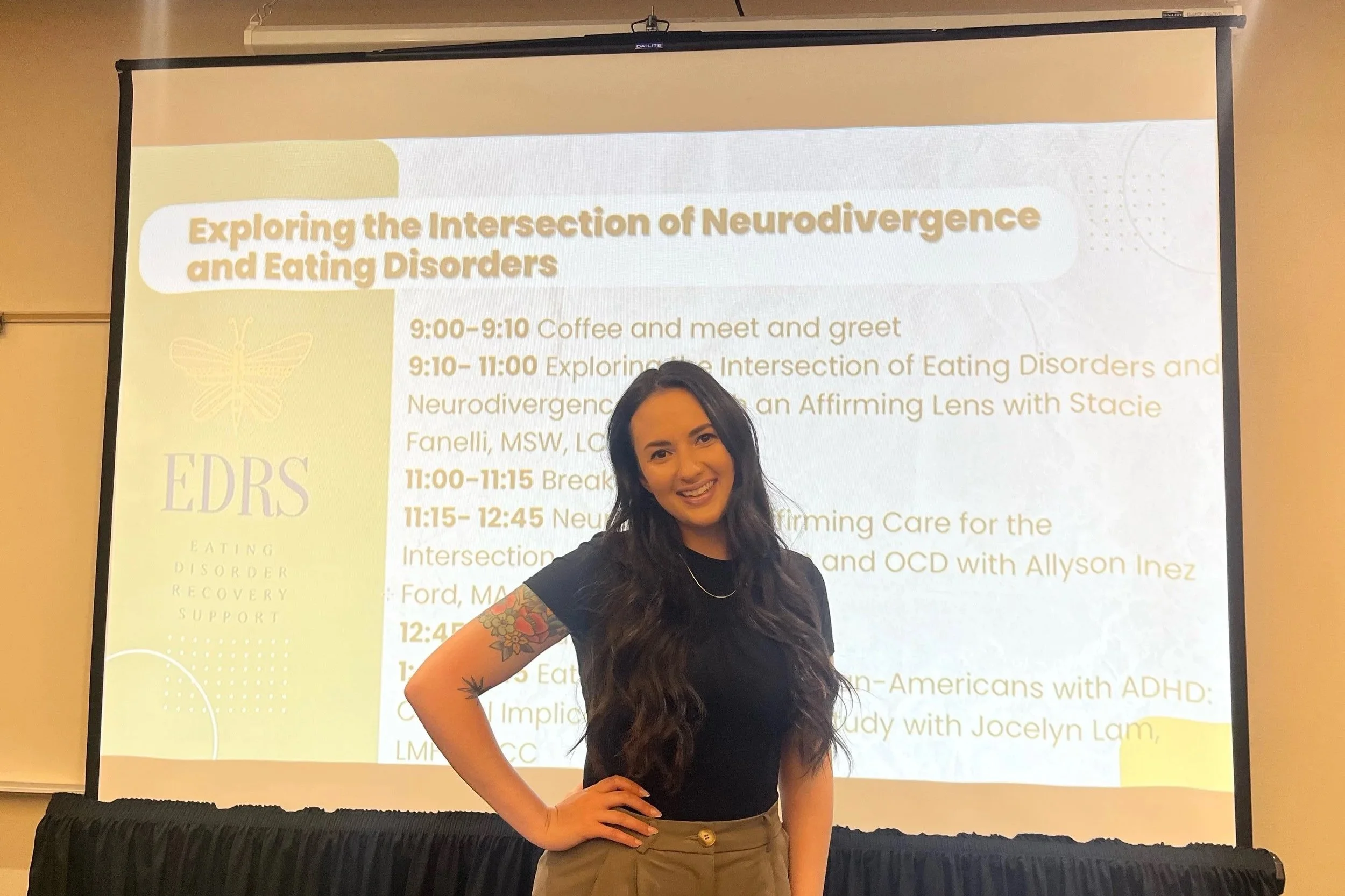 Allyson Ford speaking at EDRS conference, backdrop is slideshow presentation