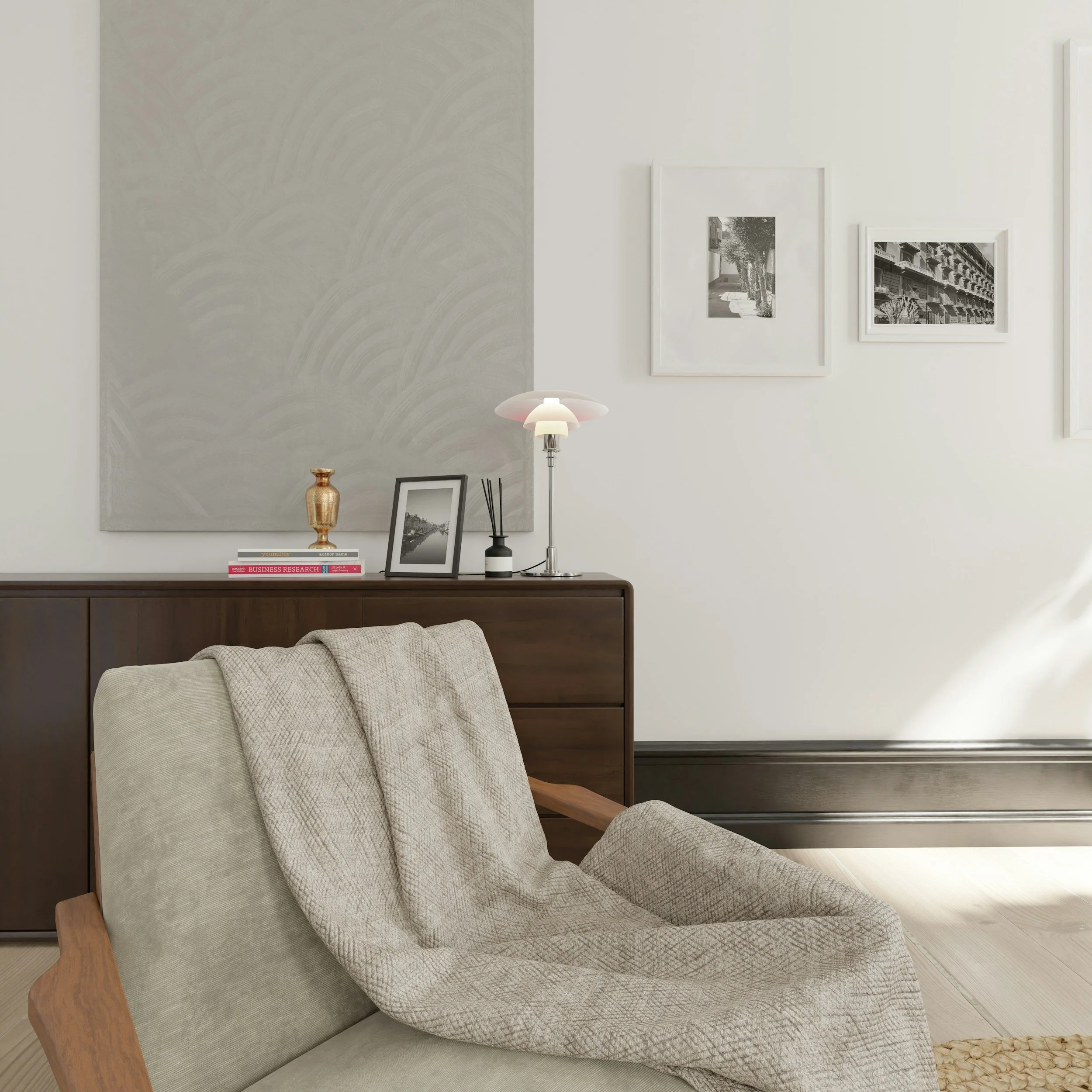 Therapy office with neutral colors, beige chair with beige blanket, soft lighting, dark brown entry table/ dresser in the background