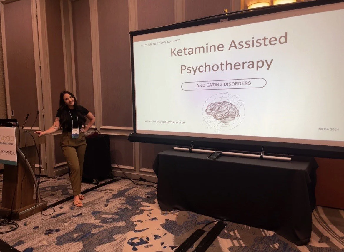 OCD therapist giving presentation at eating disorder conference