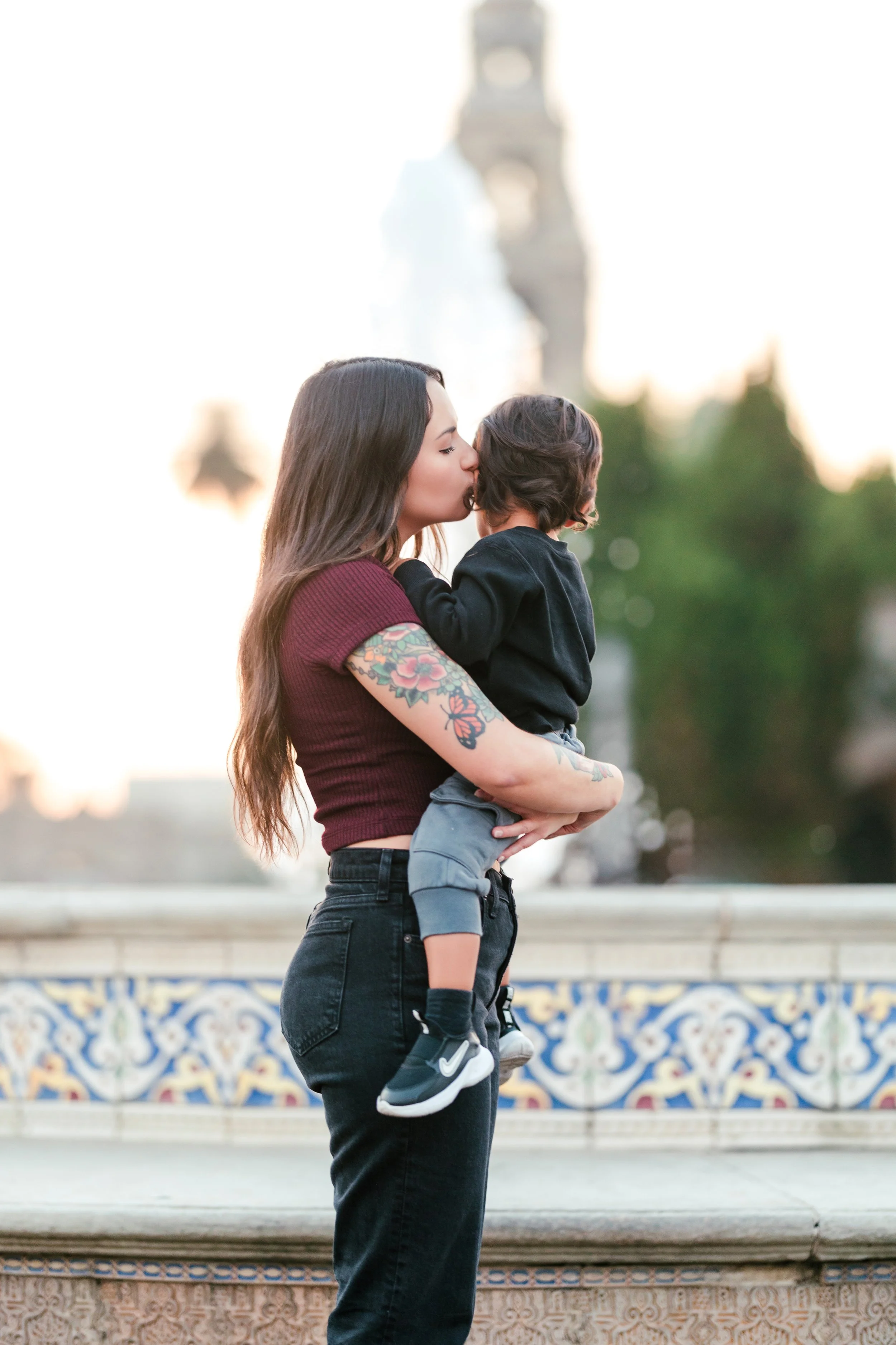 Image of mom and perinatal therapist with child outside balboa park, San Diego