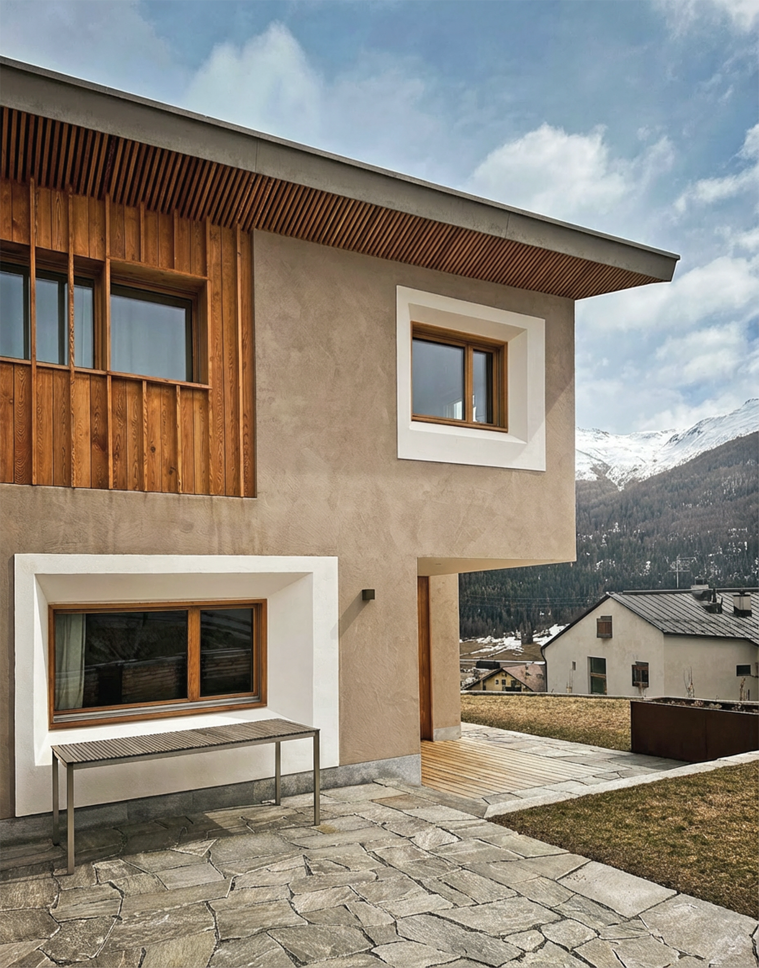 Varley-Interni-Z3069-Neubau-Engadinerhaus-Fassade-Sitzplatz.png