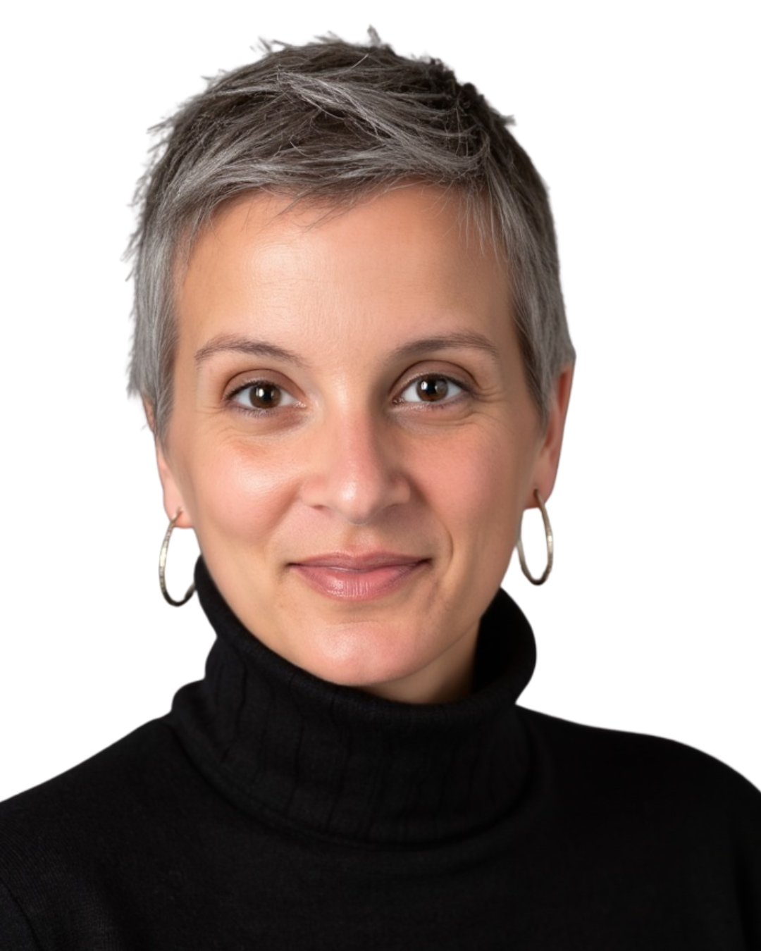 Close-up portrait of a woman with short gray hair, wearing a black turtleneck and silver hoop earrings, smiling softly on a white background.