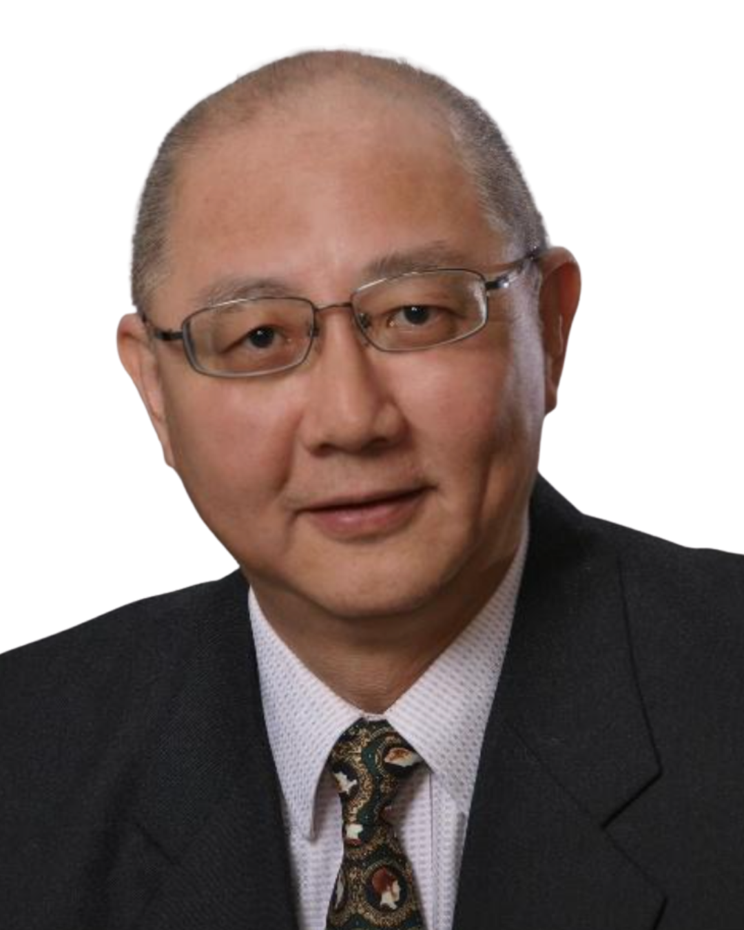 Close-up photograph of an Asian man wearing glasses, a dark suit, a white shirt, and a patterned tie, smiling and looking at the camera.