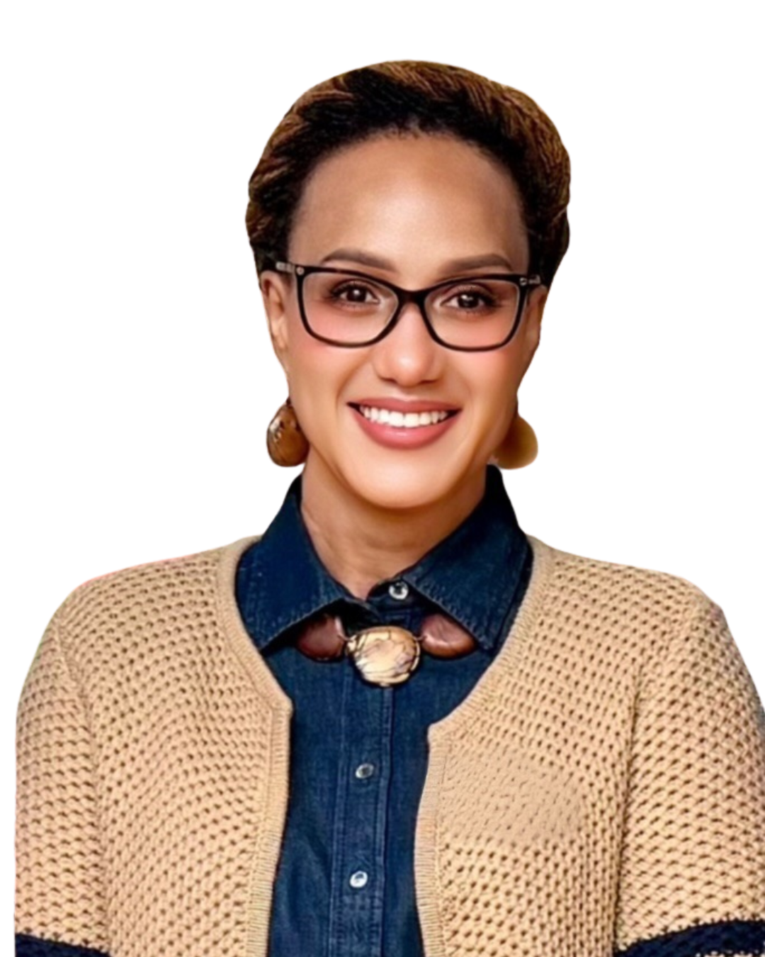 A woman with short, curly, reddish-brown hair, wearing large black glasses, a yellow blazer, and a blue top, smiling with arms crossed against a white background.