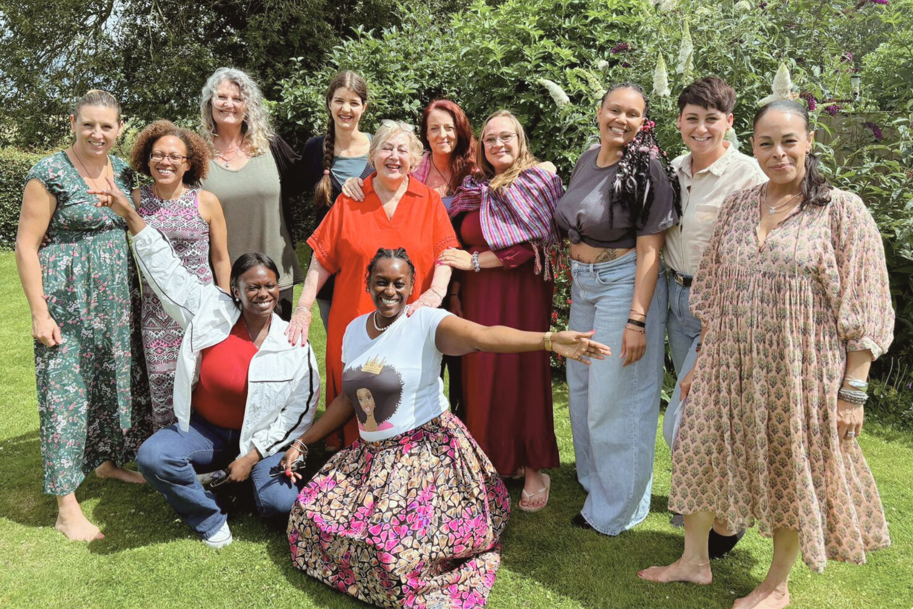 group of women smiling outside