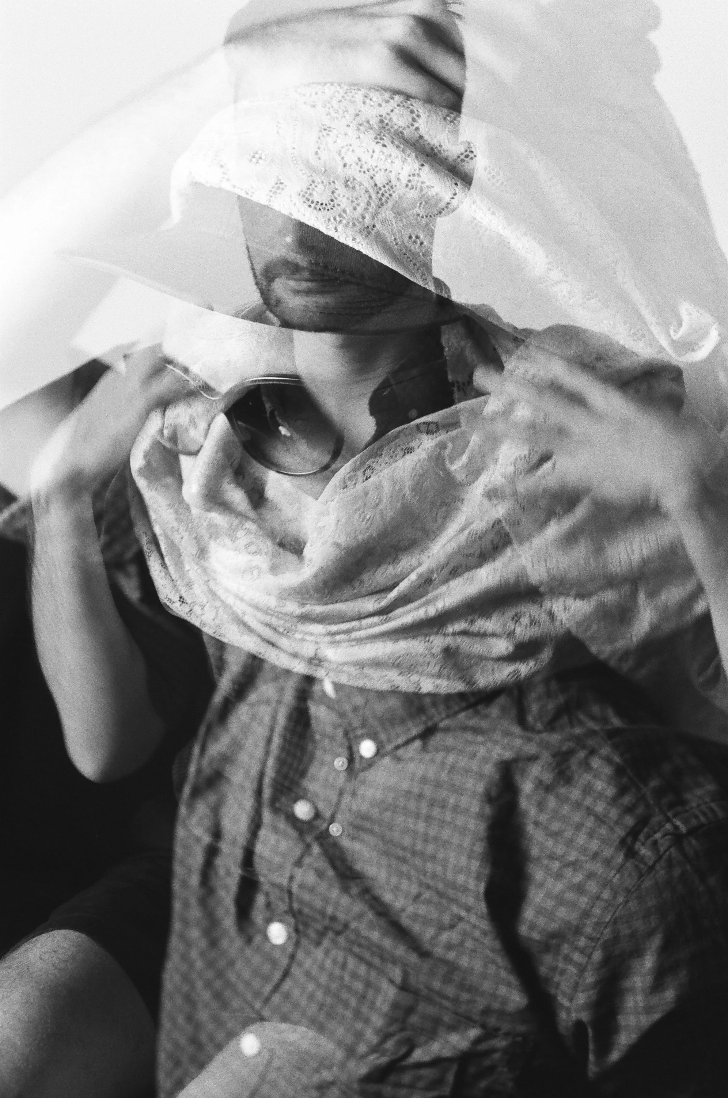 doubel exposed balck and white image of man wearing sunglasses
