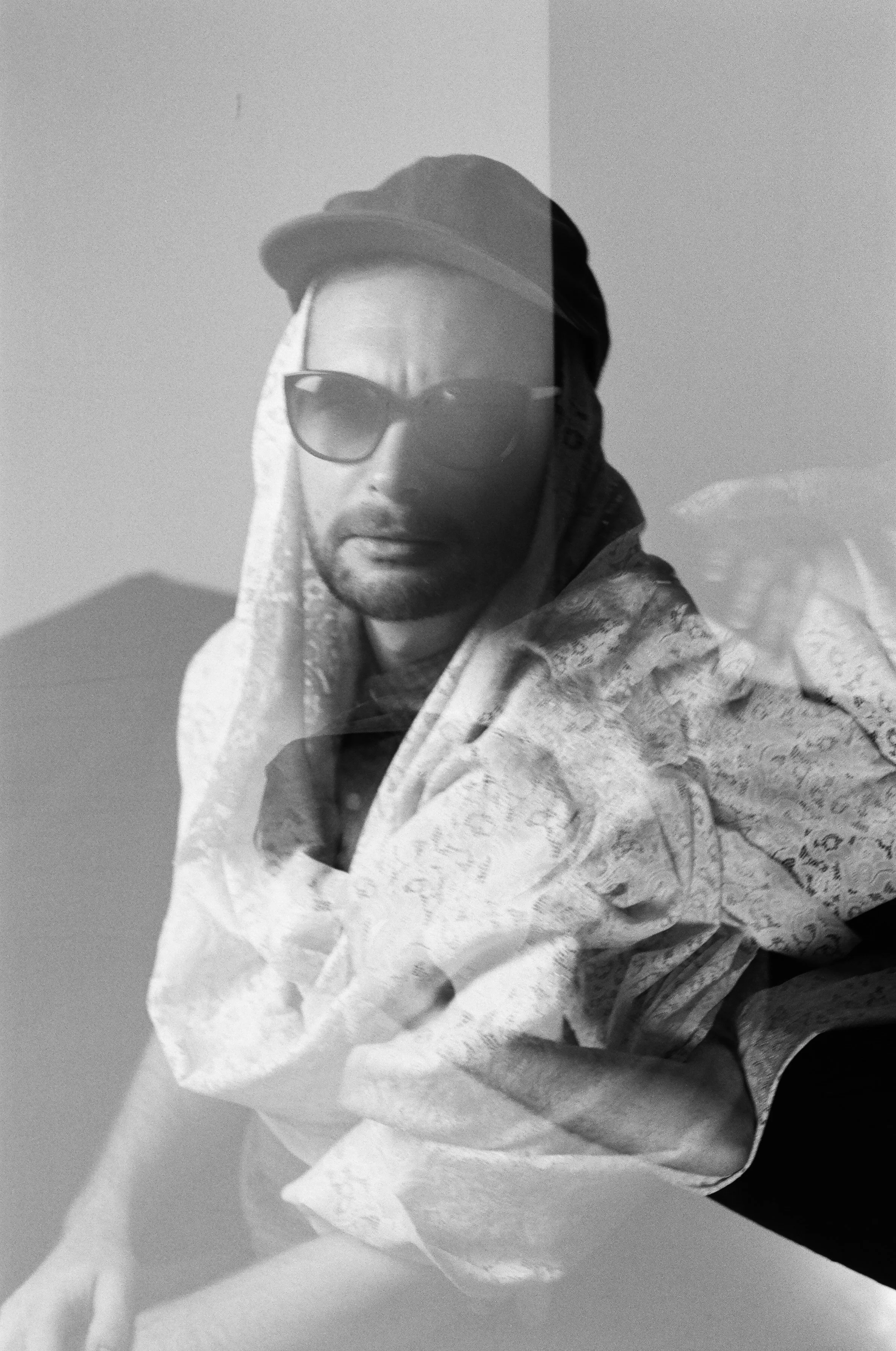doubel exposed balck and white image of man wearing sunglasses