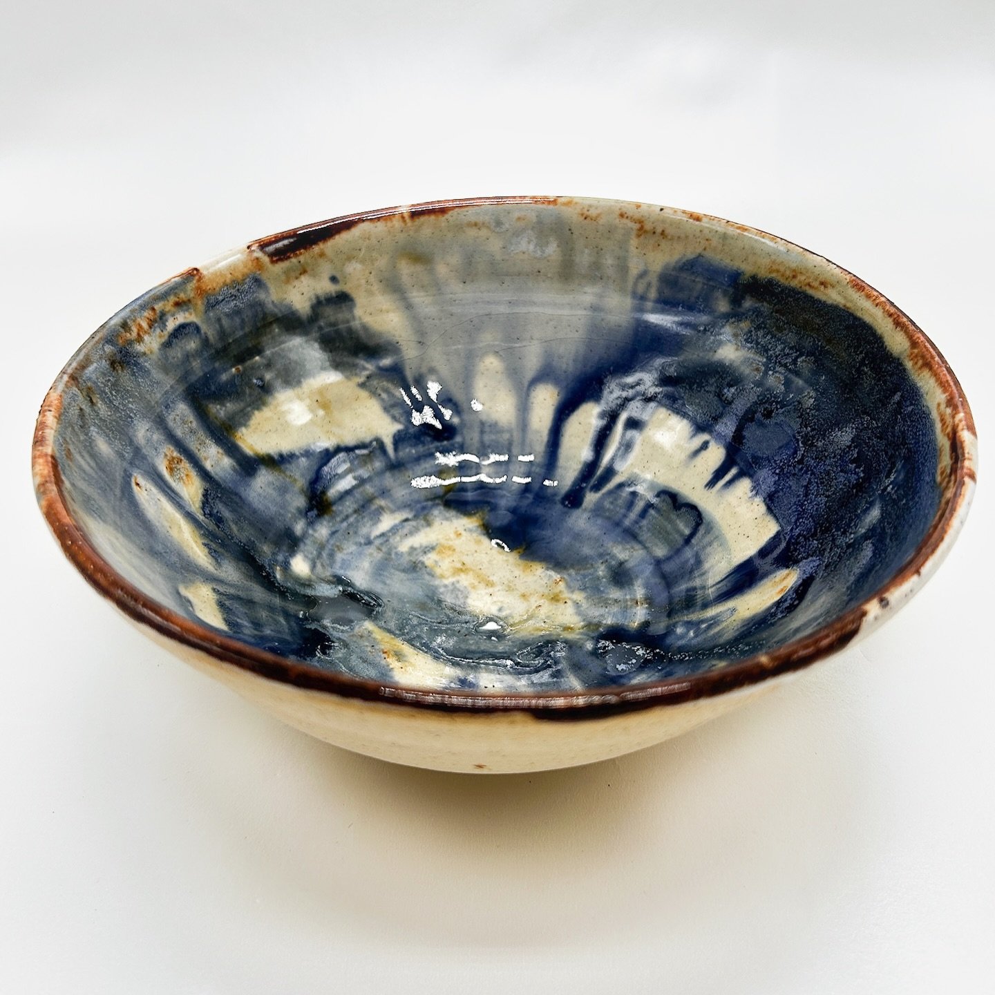 A blue drippy decorative bowl with natural raw exterior. Just a cutie lil hand thrown bowl made with blue glaze. It has a unique dual texture and natural finish. We love this one with its soooooothing colors.