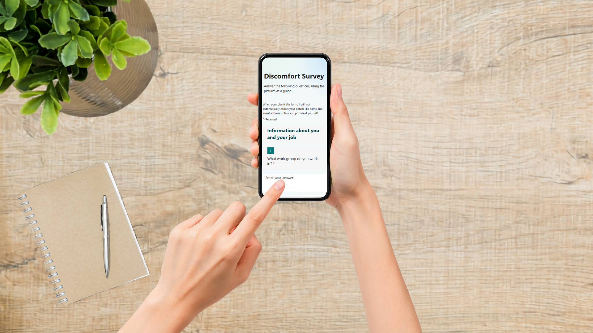 Someone holding a mobile phone completing the Digital Discomfort Survey
