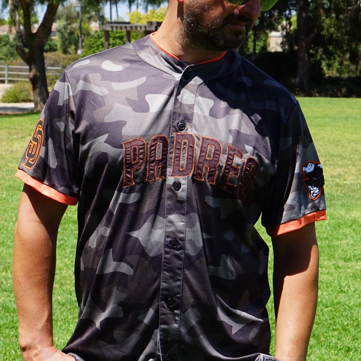π₯ Patchwork meets performance.
This Padres jersey isn’t just a statement—it’s an experience. Featuring bold patch appliqué across a slick urban camo base, detailed orange trims, and logos that pop with team pride, this piece