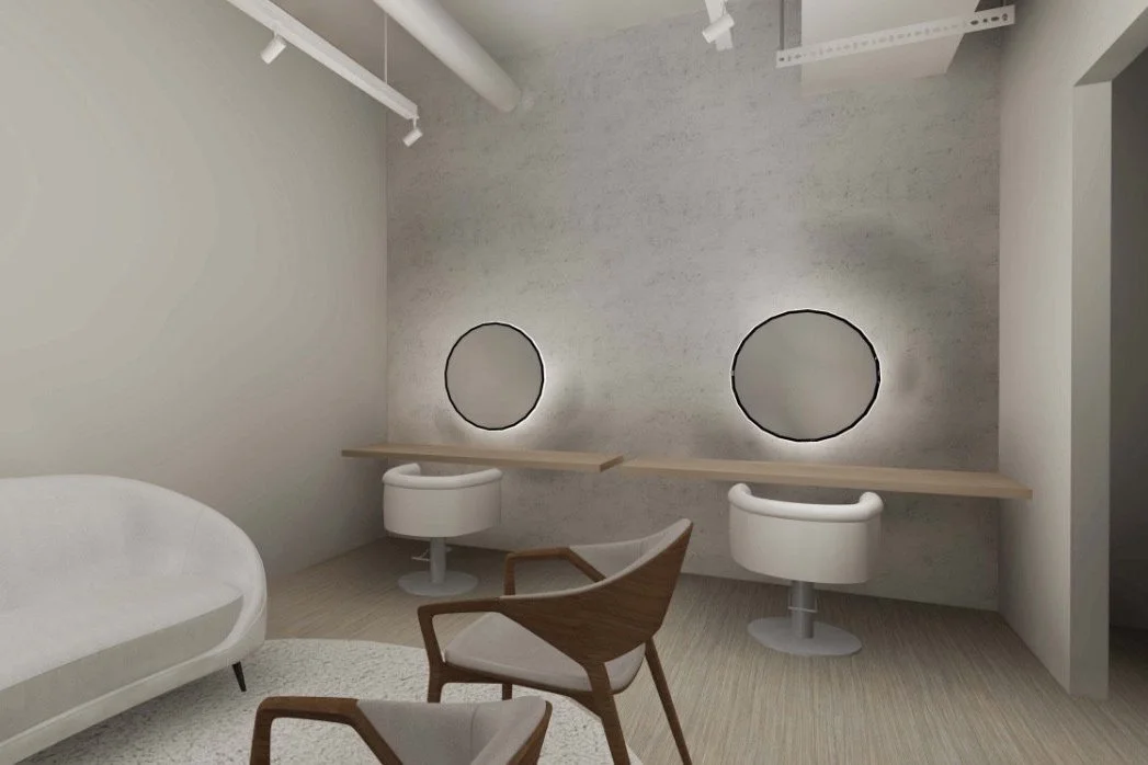 Modern minimalist interior with white walls, a beige sofa, wooden chairs, a long desk with two round mirrors, and a textured wall in a neutral color.