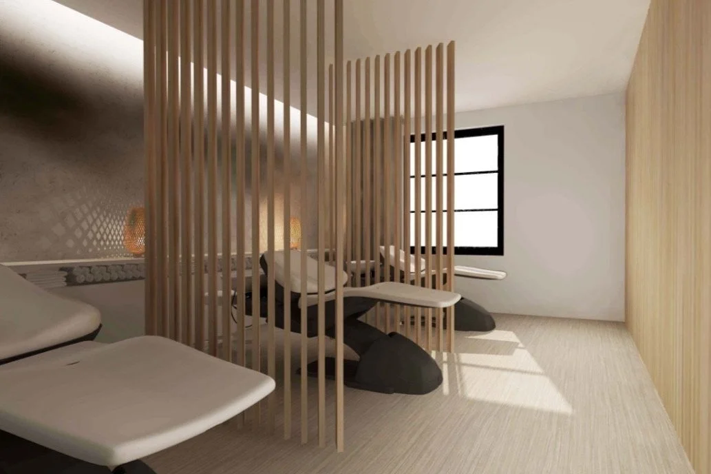 Modern room with wooden slat divider, massage chairs, window, and minimal decor