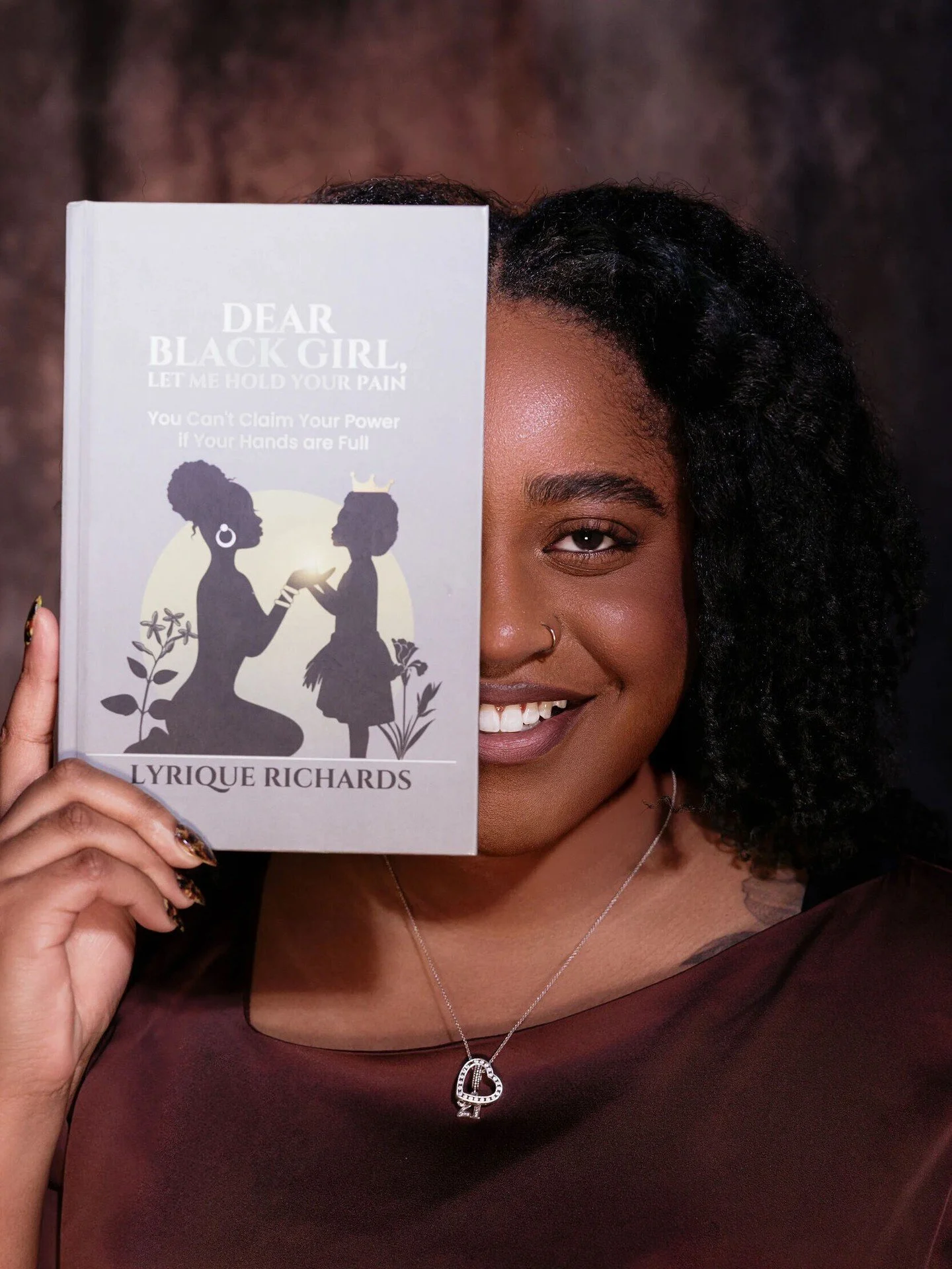 Half of my face.
All of my story.

There was a time I would have hidden more than this. Softened my voice. Made myself smaller so I could be more easily received.

This book represents the version of me who stopped doing that.

Dear Black Girl, Let M
