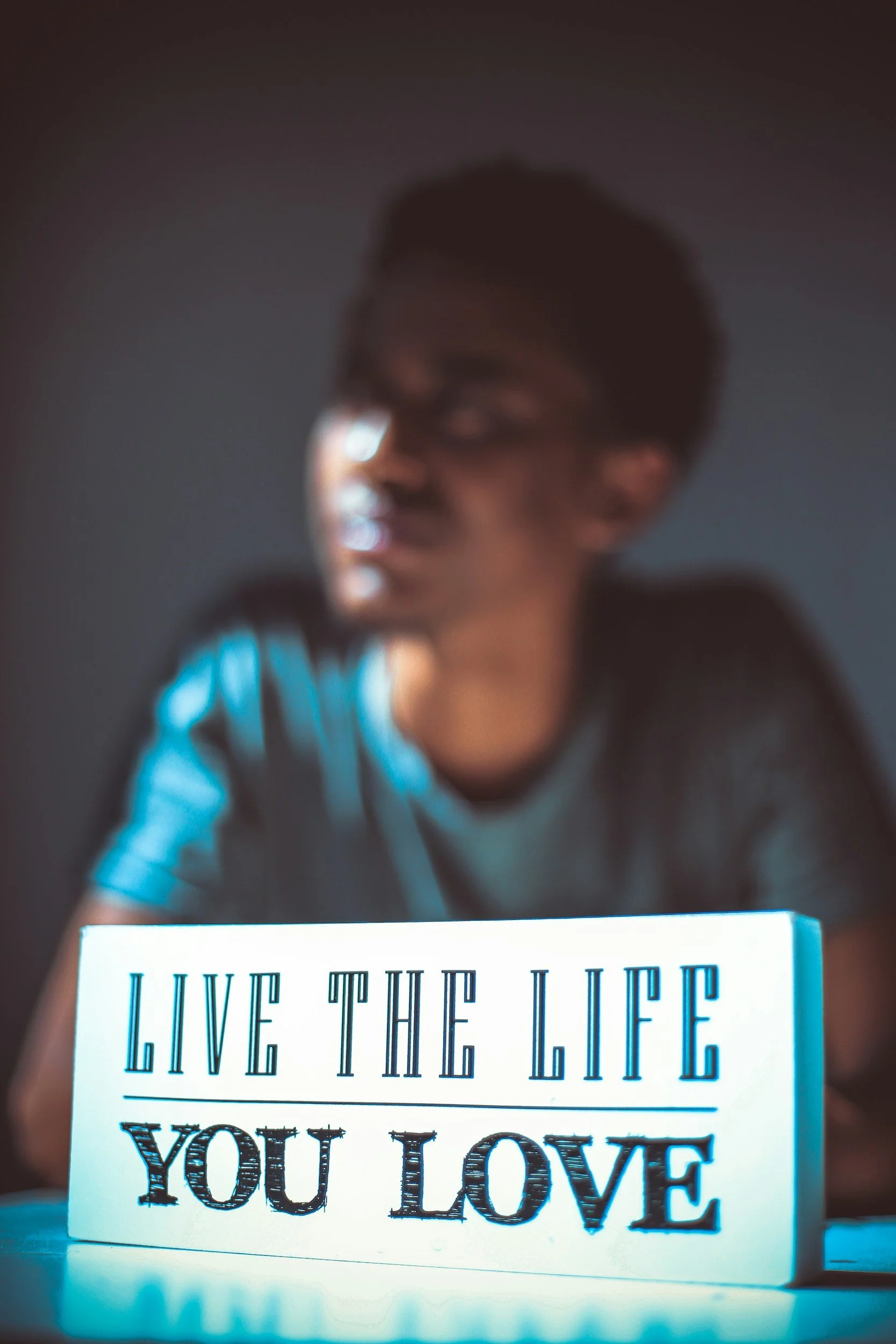 young man with the quote "Live The Life You Love"