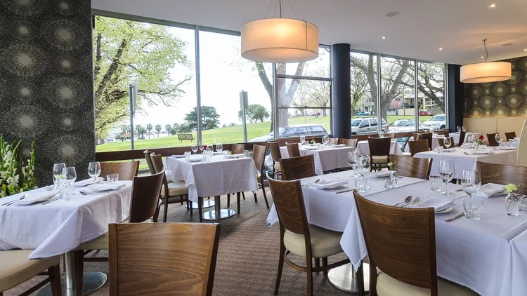 Window tables inside Eastern Spice looking over Corio Bay