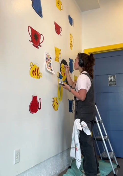 working on a mural for Sweet Patricia's Cafe 2025