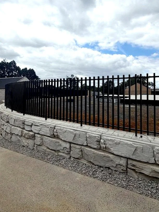 mako+blade+retaining+wall+fixed+into+pavers+auckland+aluminium+fencing+black.jpg
