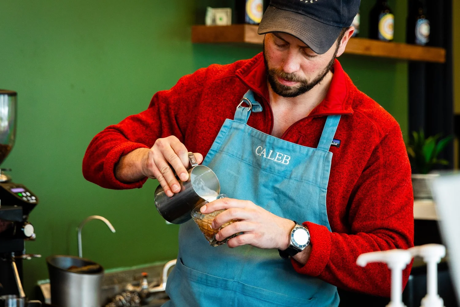 Caleb Fritz preparing coffee
