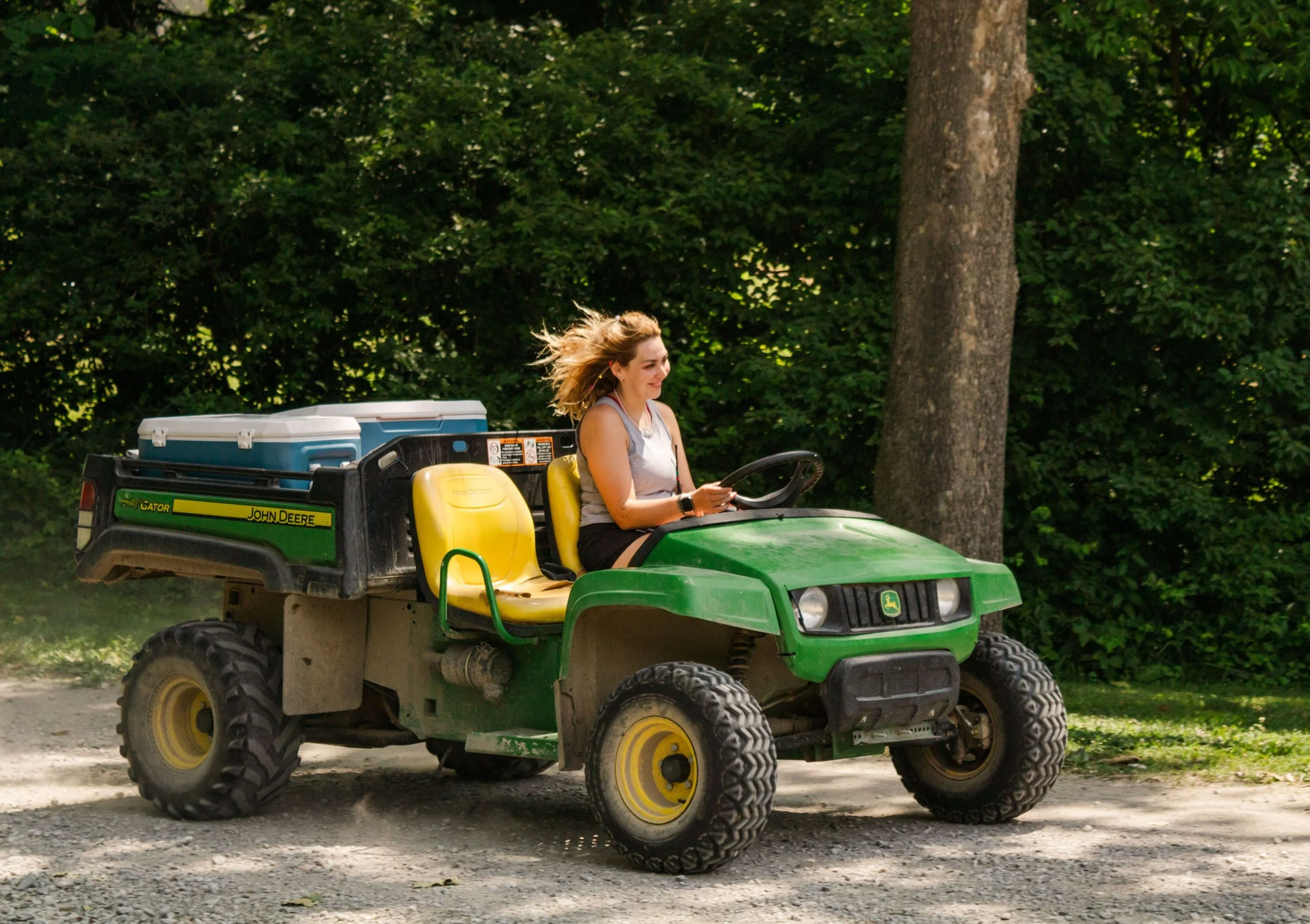 Heartland Christian Camp Paid Gap Year Internship woman driving and smiling Outside Near Kansas City, Missouri