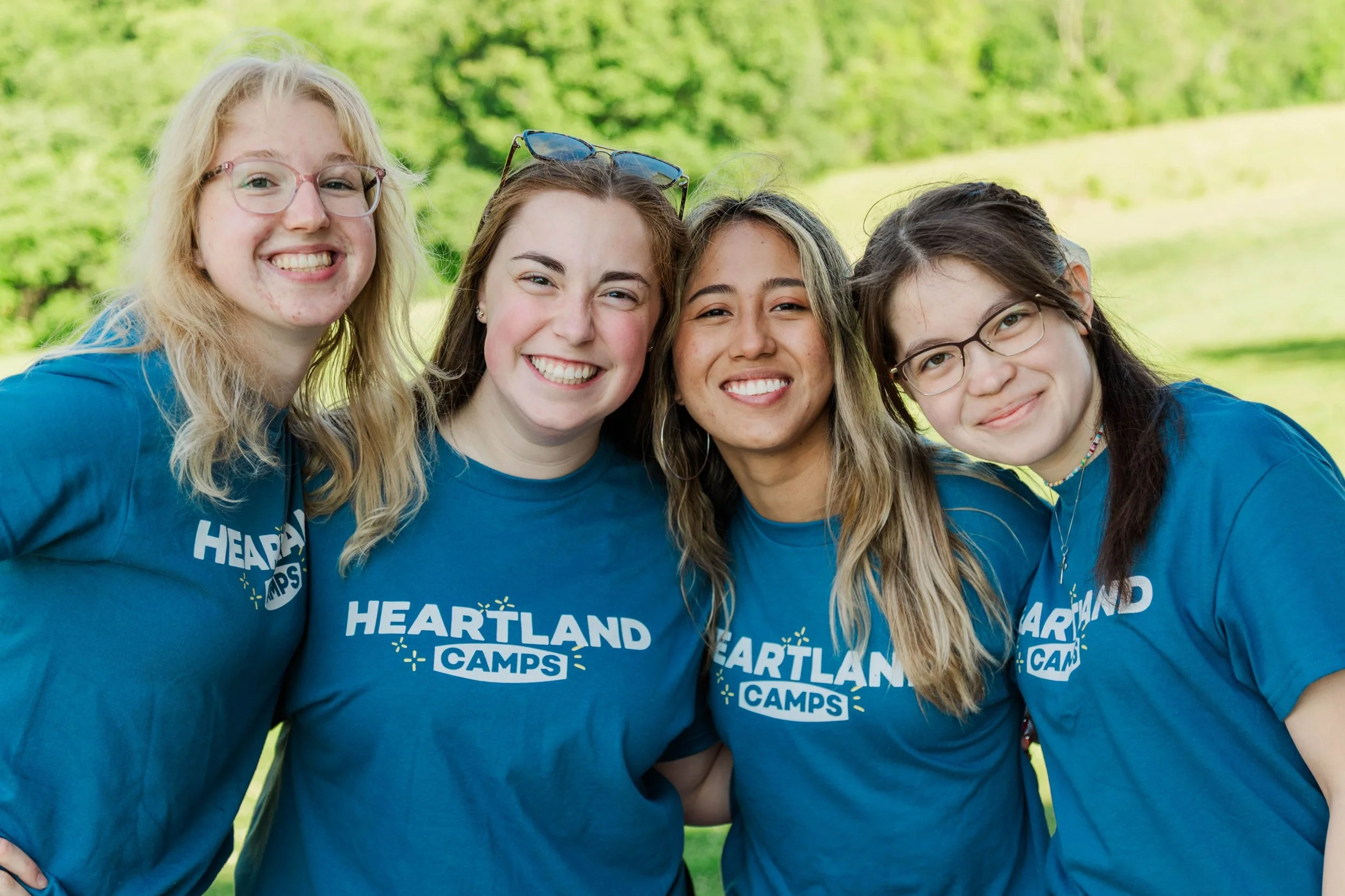 Heartland Christian Camp Paid Gap Year Internship women standing and smiling together Outside Near Kansas City, Missouri
