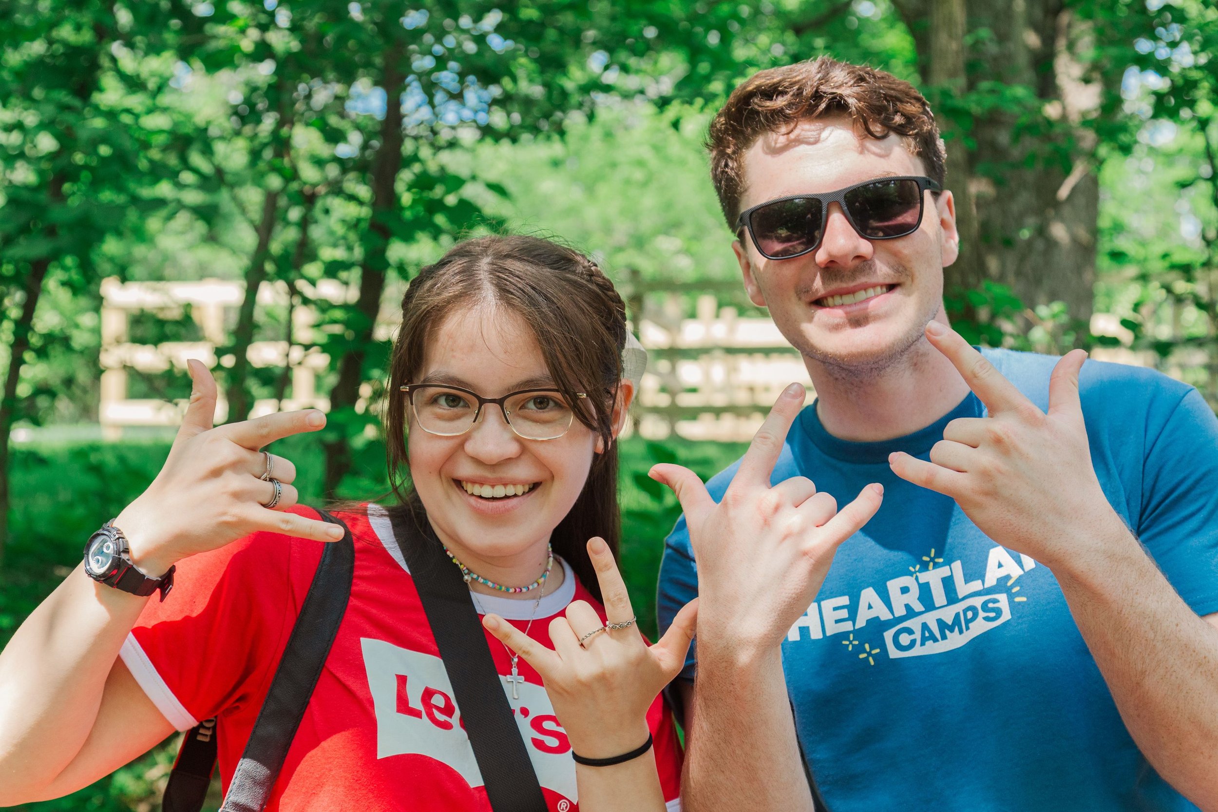 Heartland Christian Camp Paid Gap Year Internship Man and Woman Standing and Smiling Together Outside Near Kansas City, Missouri