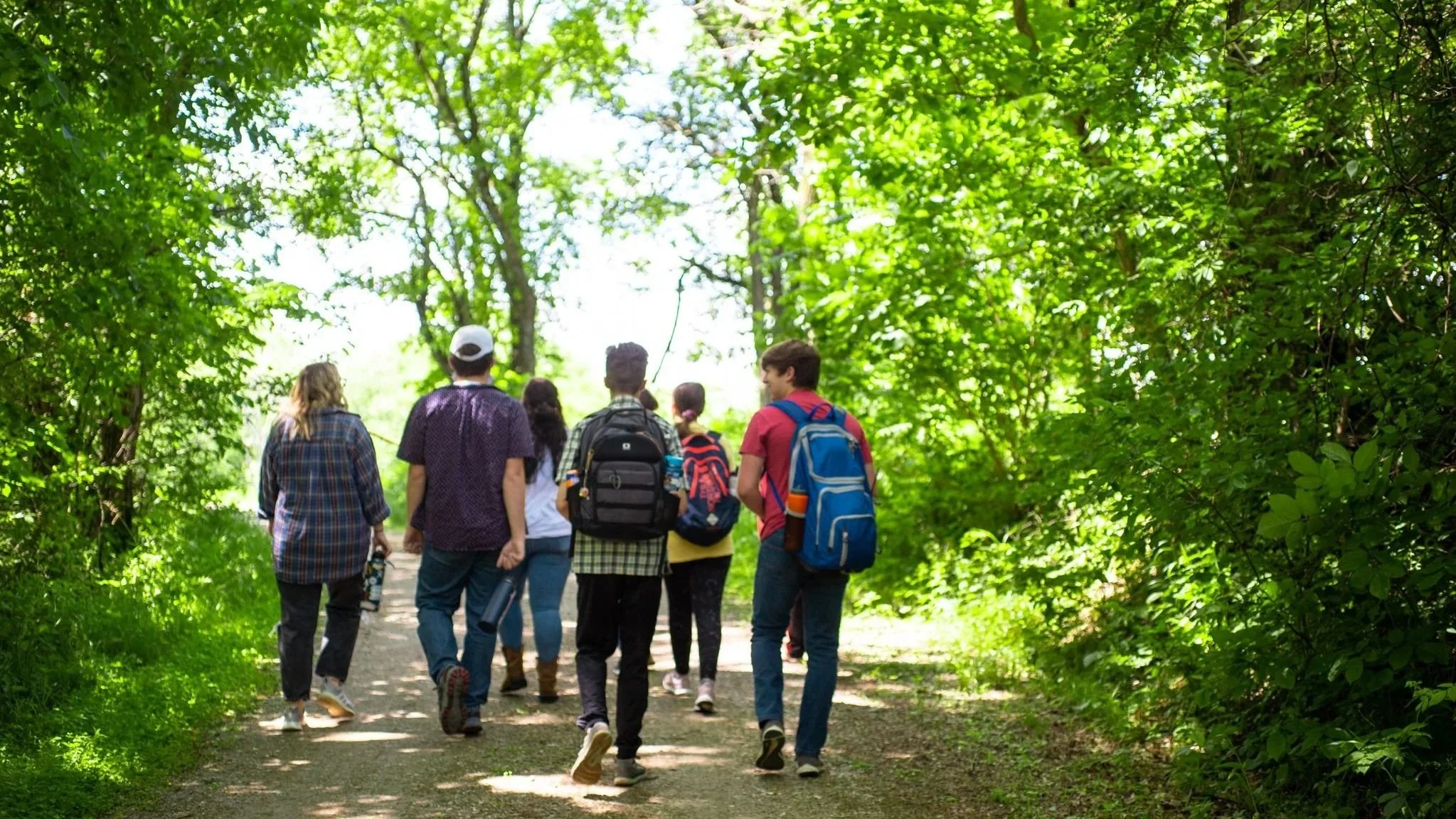 Heartland Christian Camp Paid Gap Year Internship Men and Women Walking and Smiling Together Outside Near Kansas City, Missouri