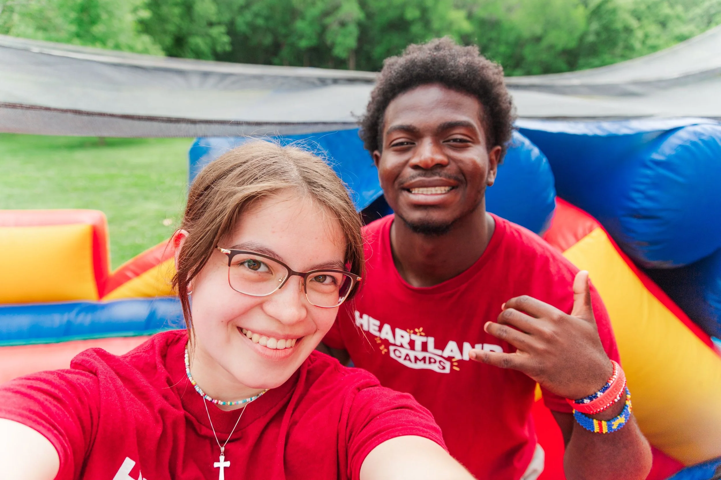 Heartland Christian Camp Paid Gap Year Internship Man and Woman Standing and Smiling Together Outside having fun Near Kansas City, Missouri
