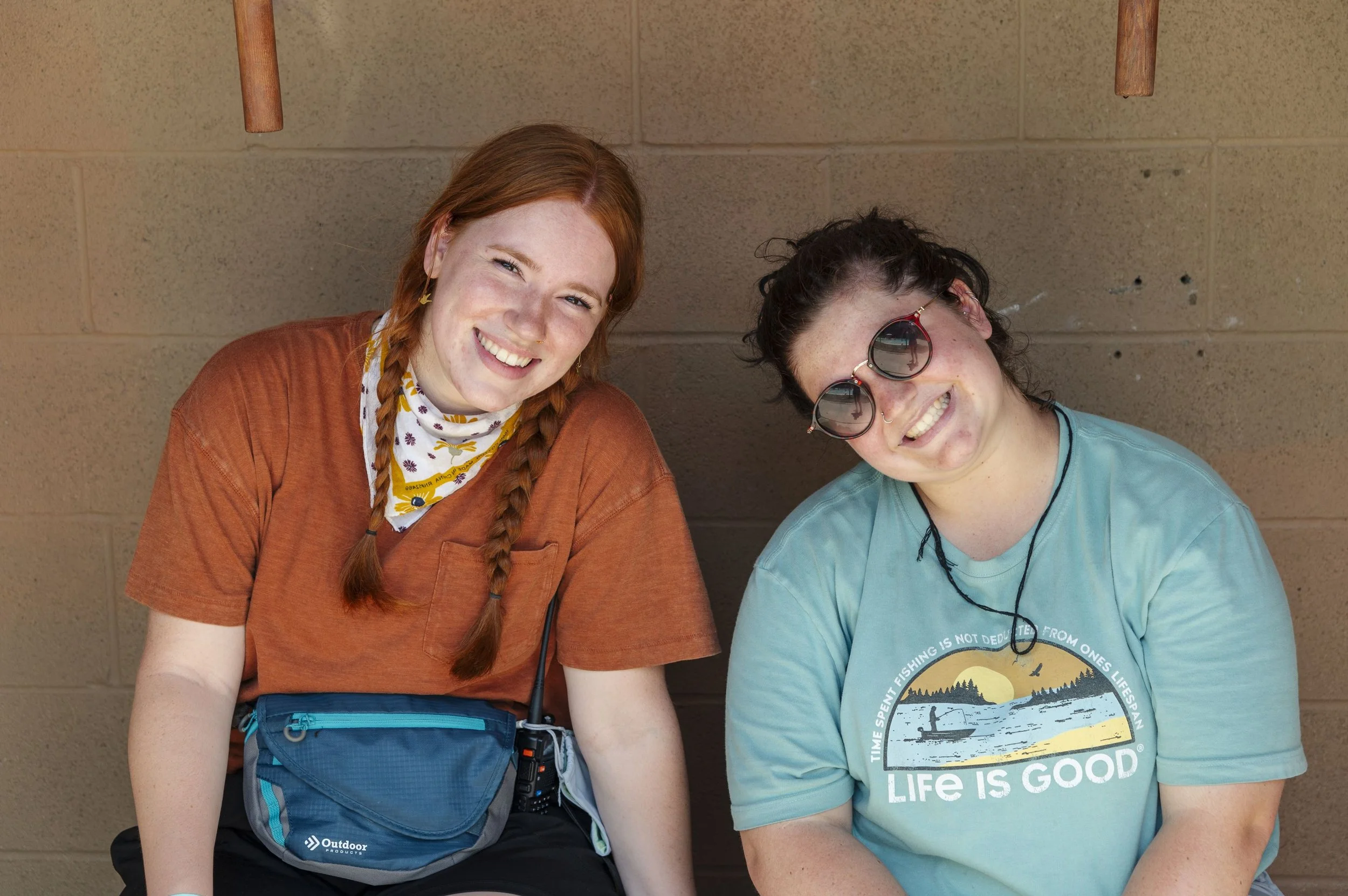 Heartland Christian Camp Paid Gap Year Internship two Women Sitting Together smiling Outside Near Kansas City, Missouri