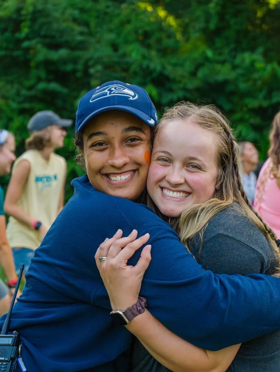Heartland Christian Camp Paid Gap Year Internship Two Women Hugging and Happy Outside Near Kansas City, Missouri