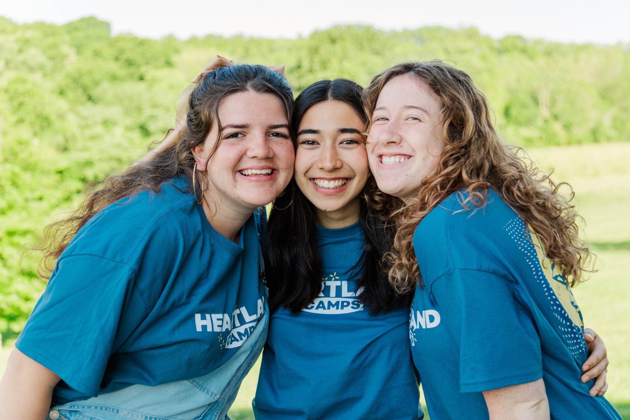 Heartland Christian Camp Paid Gap Year Internship women standing and smiling together Outside Near Kansas City, Missouri