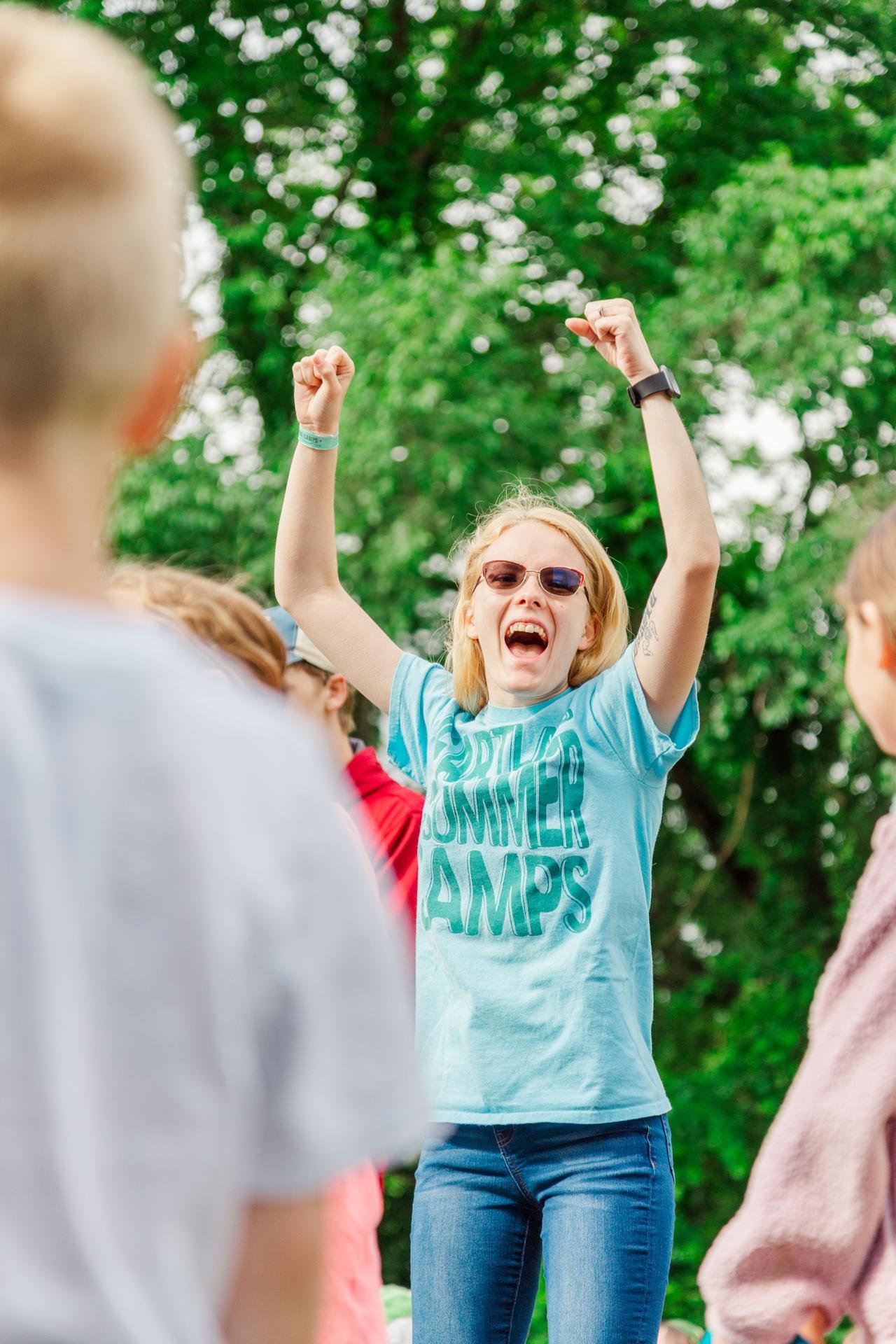 Heartland Christian Camp Paid Gap Year Internship Woman singing loudly and happy Outside Near Kansas City, Missouri