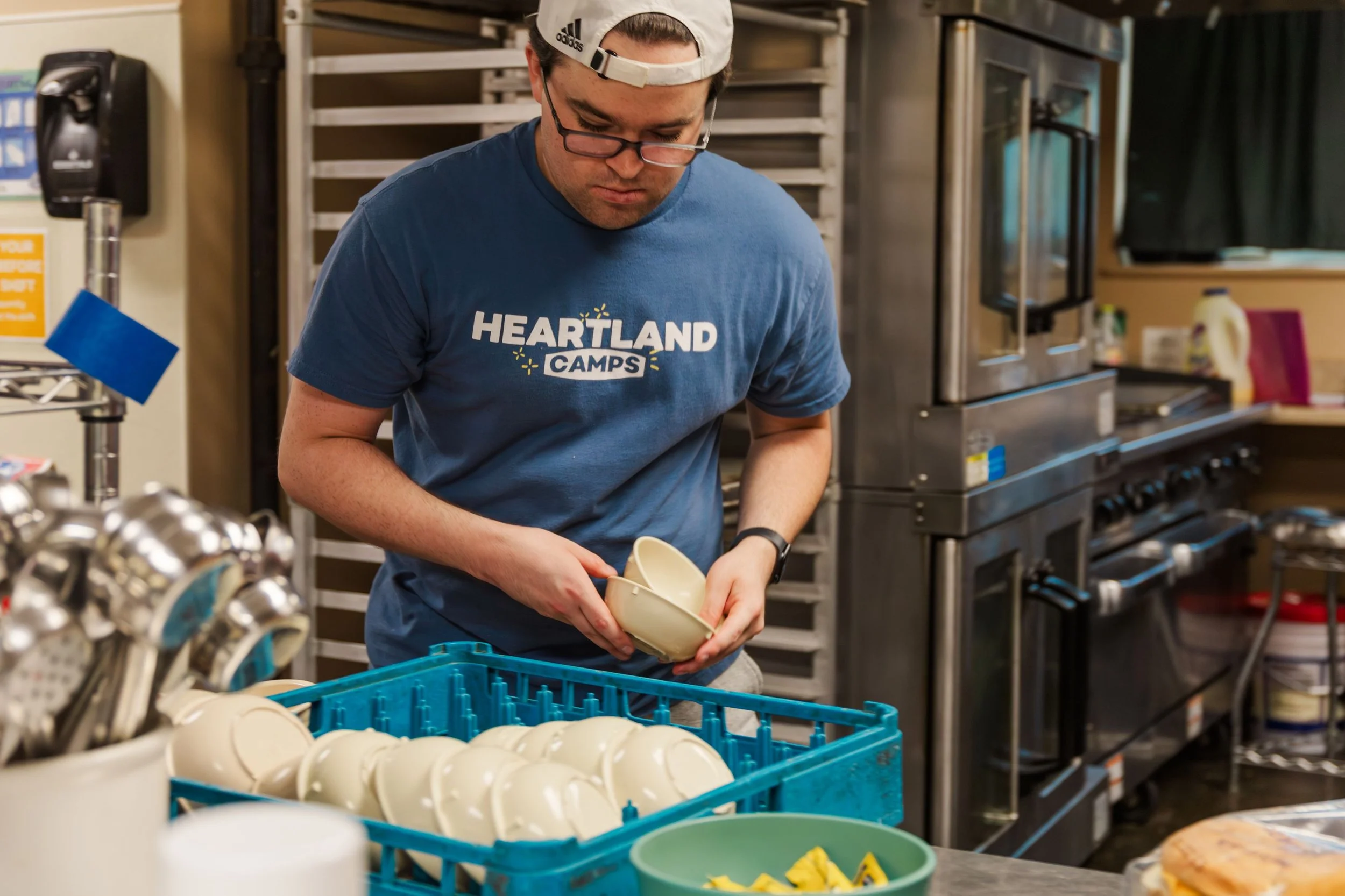 Heartland Christian Camp Paid Gap Year Internship man standing and working hard in a kitchen Near Kansas City, Missouri