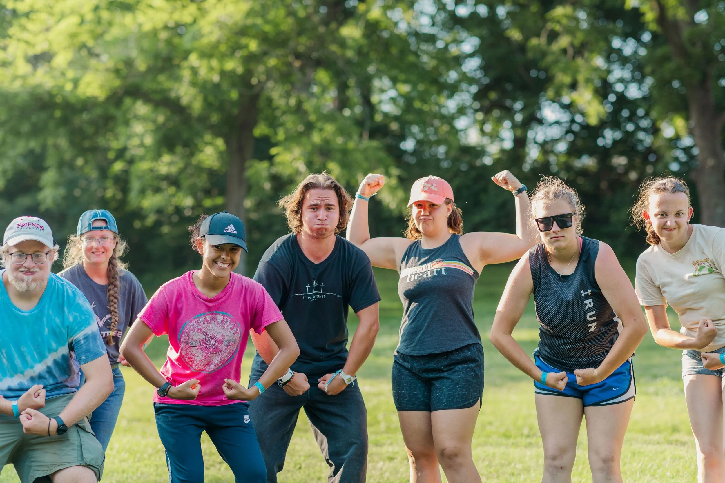 Heartland Christian Camp Paid Gap Year Internship Men and Women Standing and making silly poses Together Outside Near Kansas City, Missouri