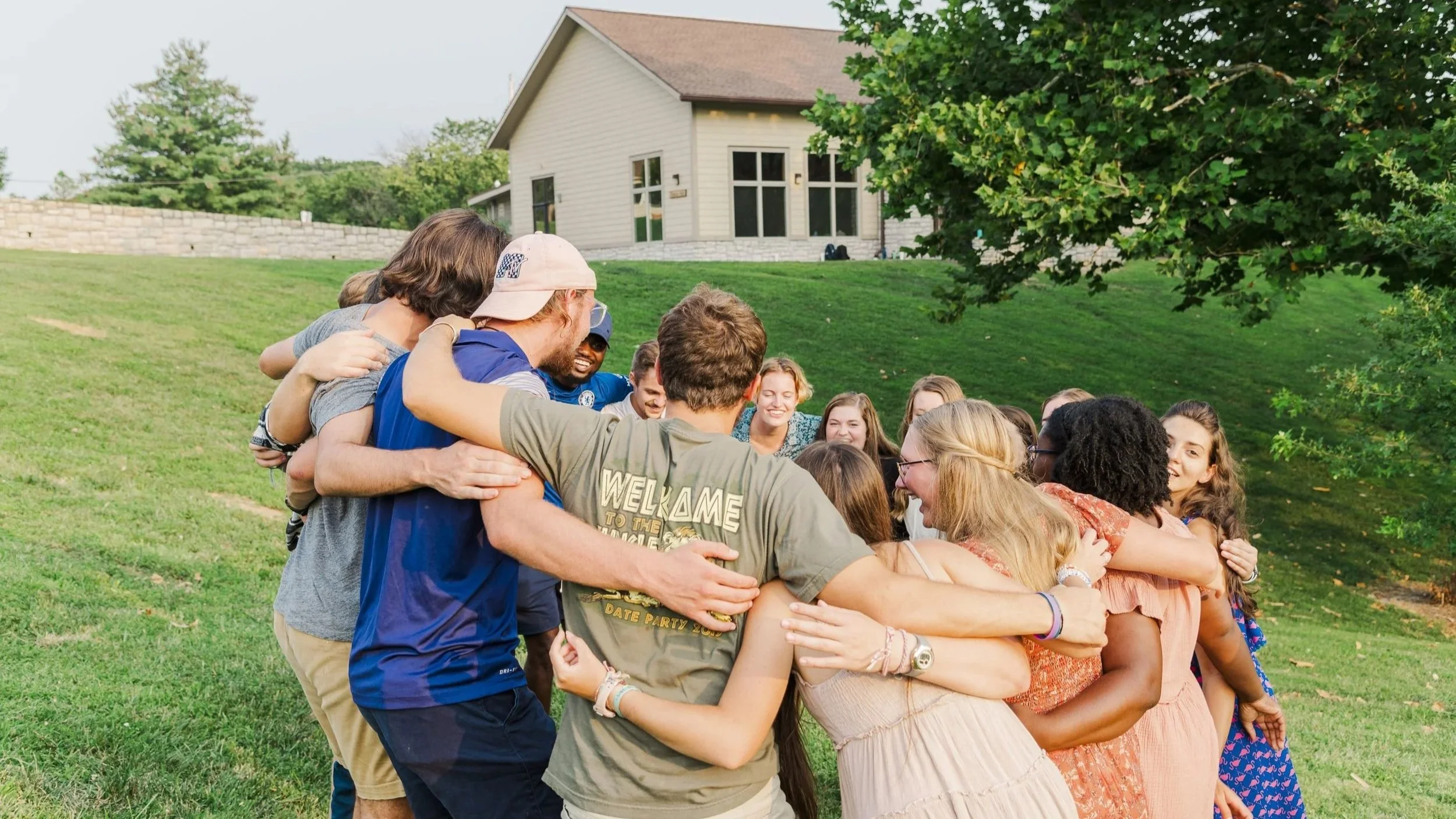 College age Christian young adults in Heartland Christian Gap Year Program working outside in Parkville, Missouri at Heartland Camp.