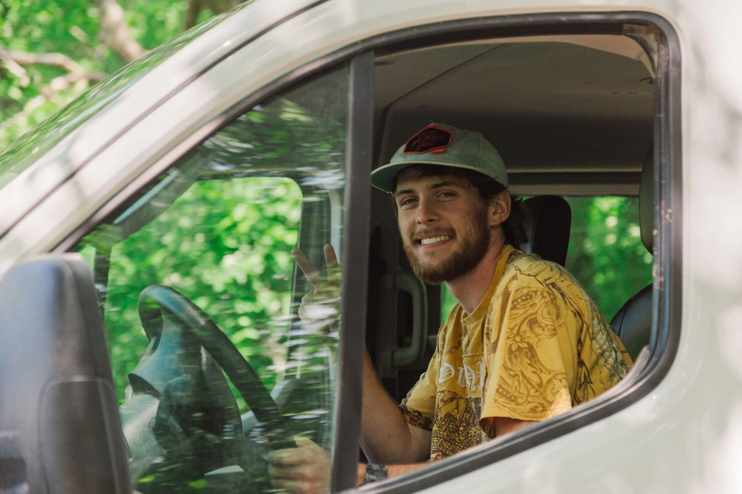 Heartland Christian Camp Paid Gap Year Internship man driving and smiling Outside Near Kansas City, Missouri