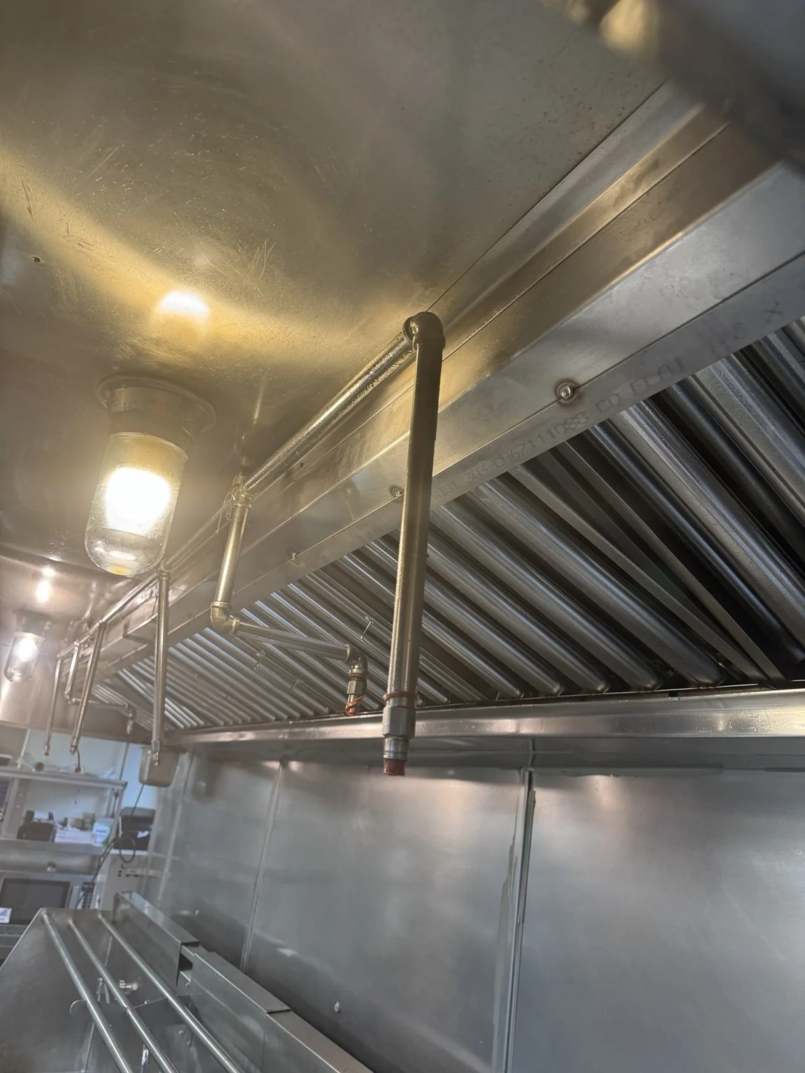 Commercial Exhaust Hood Repair Damaged supports were causing the hood filters to fall out. The damaged area was repaired and welded to restore proper support and keep the filters securely in place.