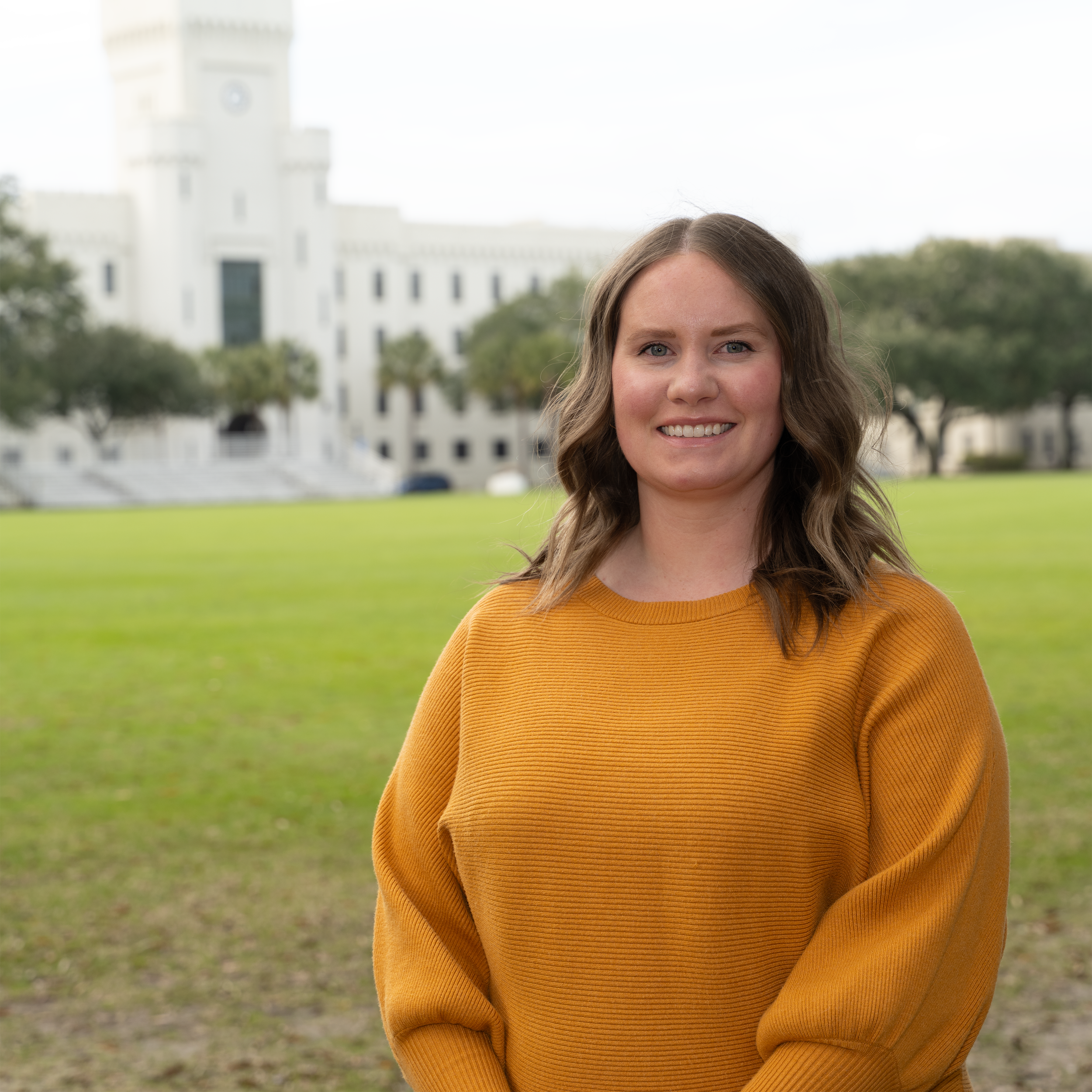 A grayscale, faceless illustration of a woman with shoulder-length hair wearing a top with a rounded neckline.