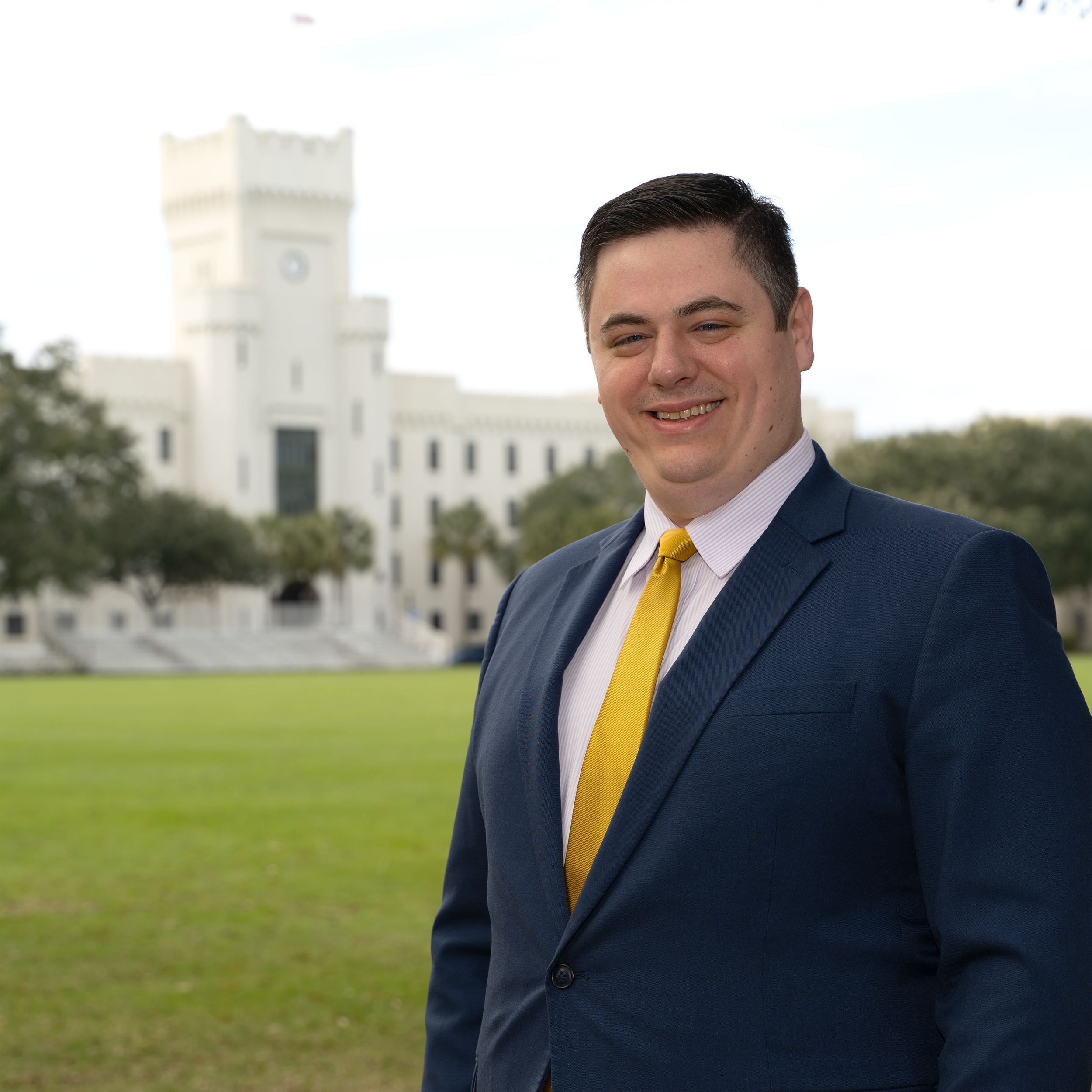 Silhouette of a man wearing a suit and tie.