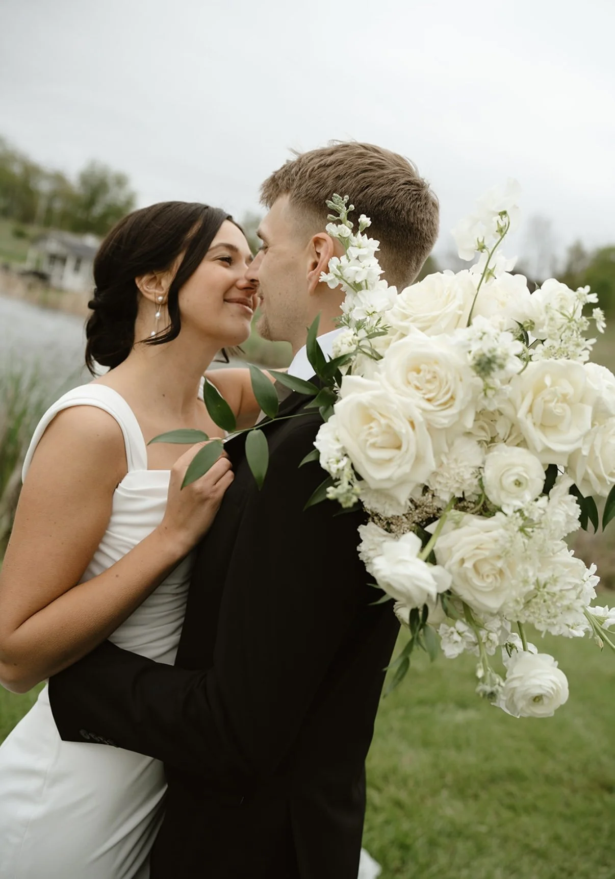 White and Green Bouquet with Bride and Groom