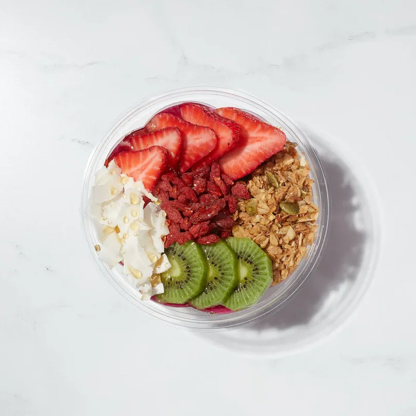 Dragonberry Bowl with strawberries, kiwi, granola and almonds at Toastique on Sunset
