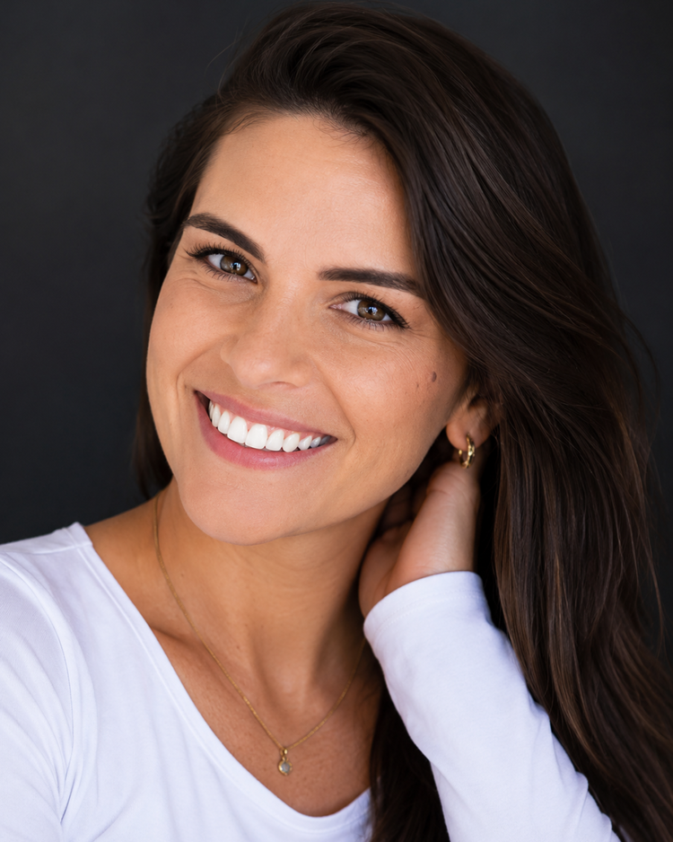 Smiling woman against a dark background