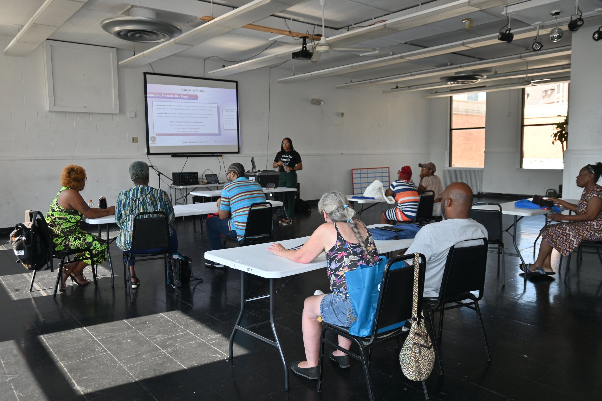 Participants sitting at tables during a financial literacy seminar led by Jaelyn Vickery and Cunningham Township.