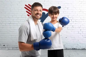 Dad supporting son, martial arts, boxing, teaching, learning, supporting, kids, leadership