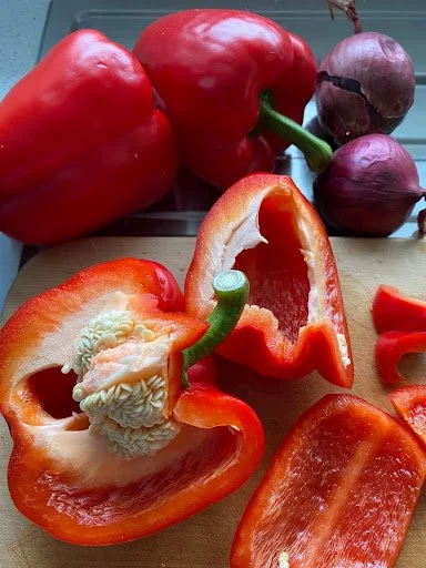 Look at these glorious capsicums &mdash; large, glowing beauties I simply couldn&rsquo;t resist. 

Red onions are always in my hit parade, and as I selected them, I found myself thinking yet again: there&rsquo;s a painting in that. Truly, the whole v
