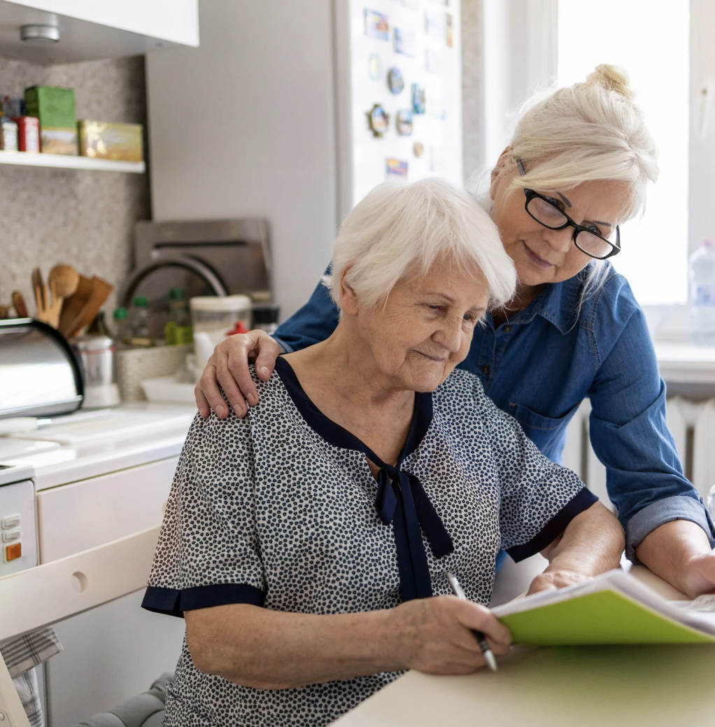 Woman helps her elderly mother with documents