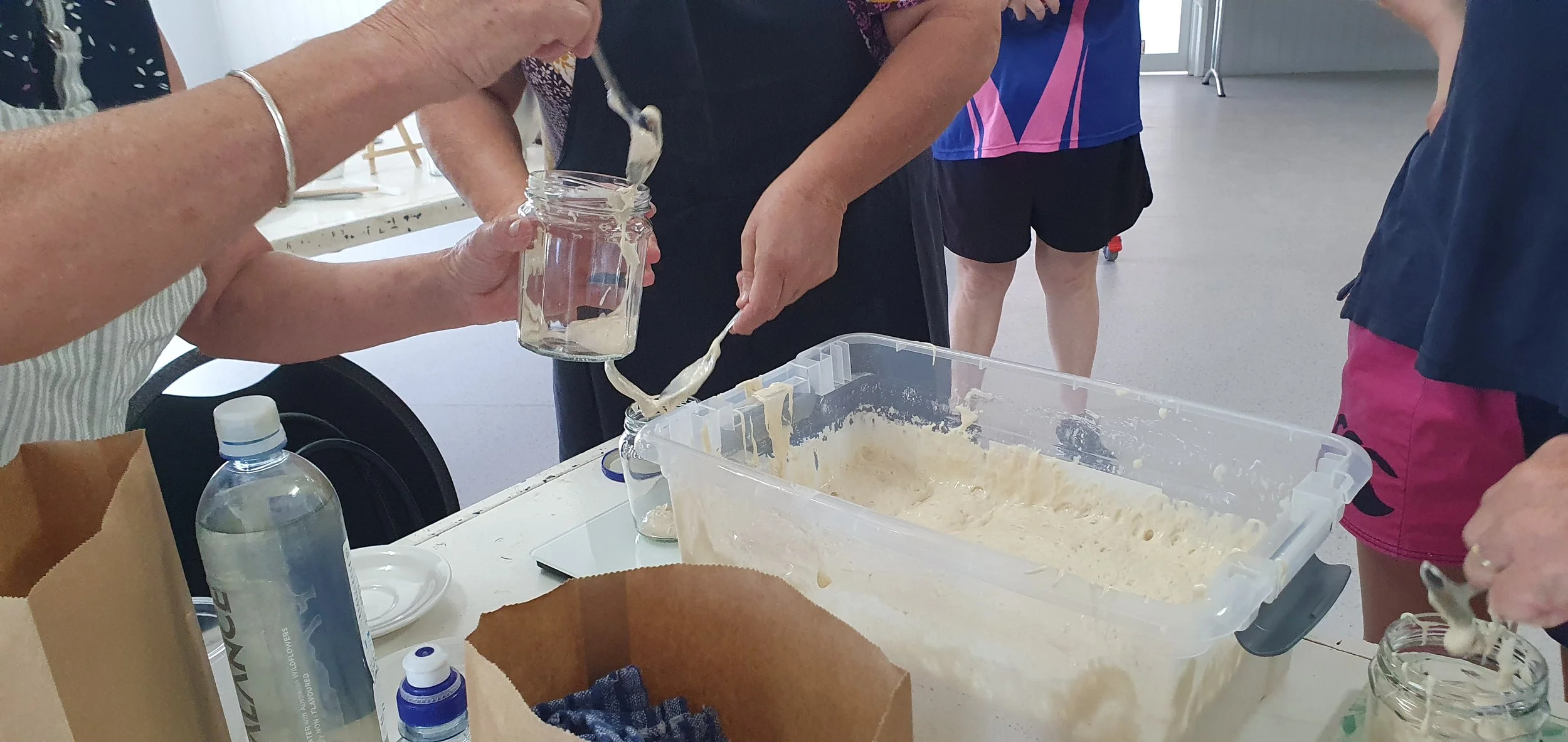 communitymembersscoopingsourdoughstarter