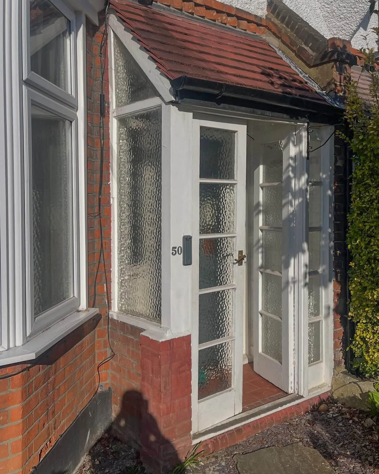 Original timber French doors and porch