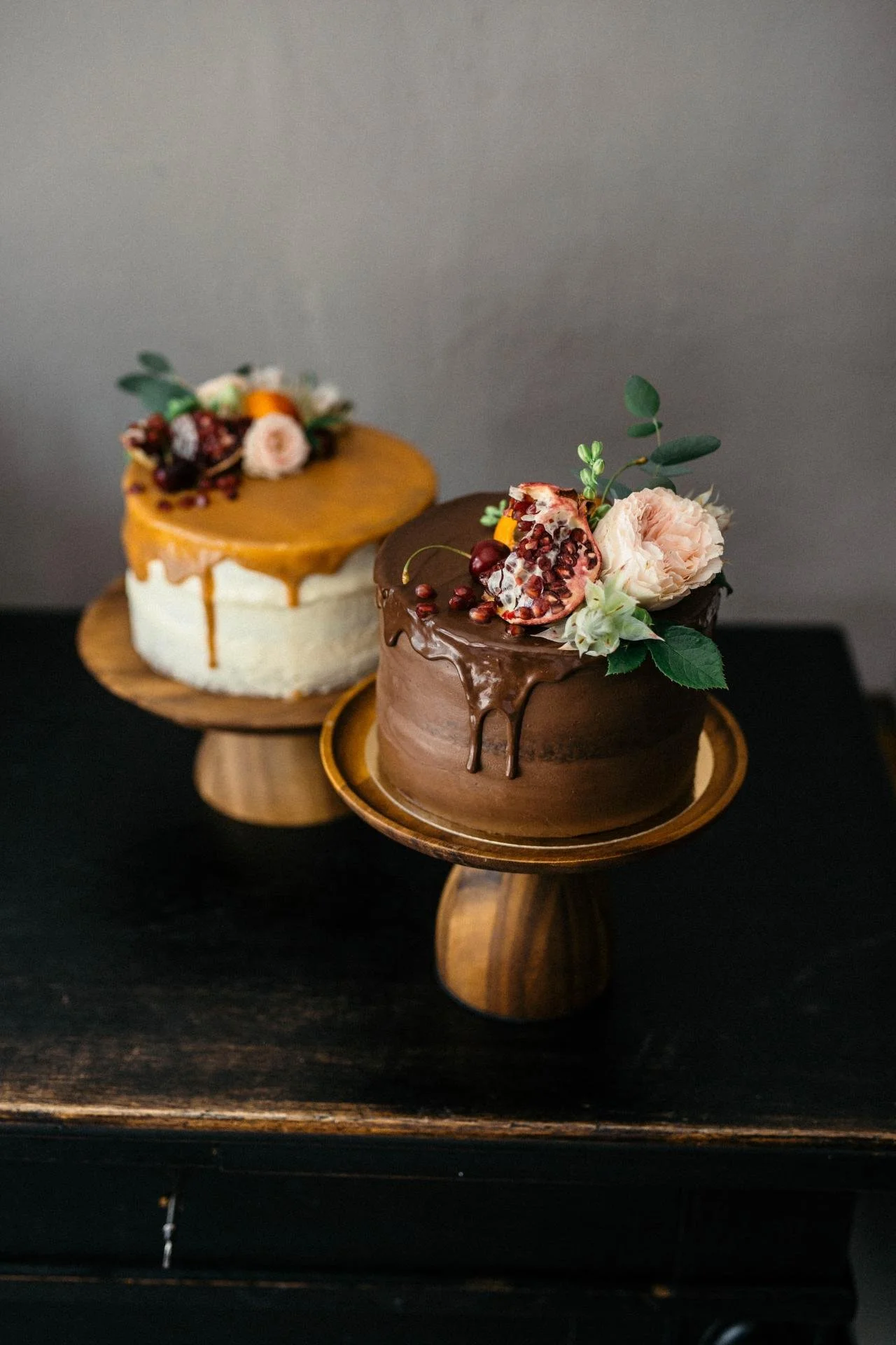 Selection of handcrafted birthday cakes with chocolate, fruit and floral decorations