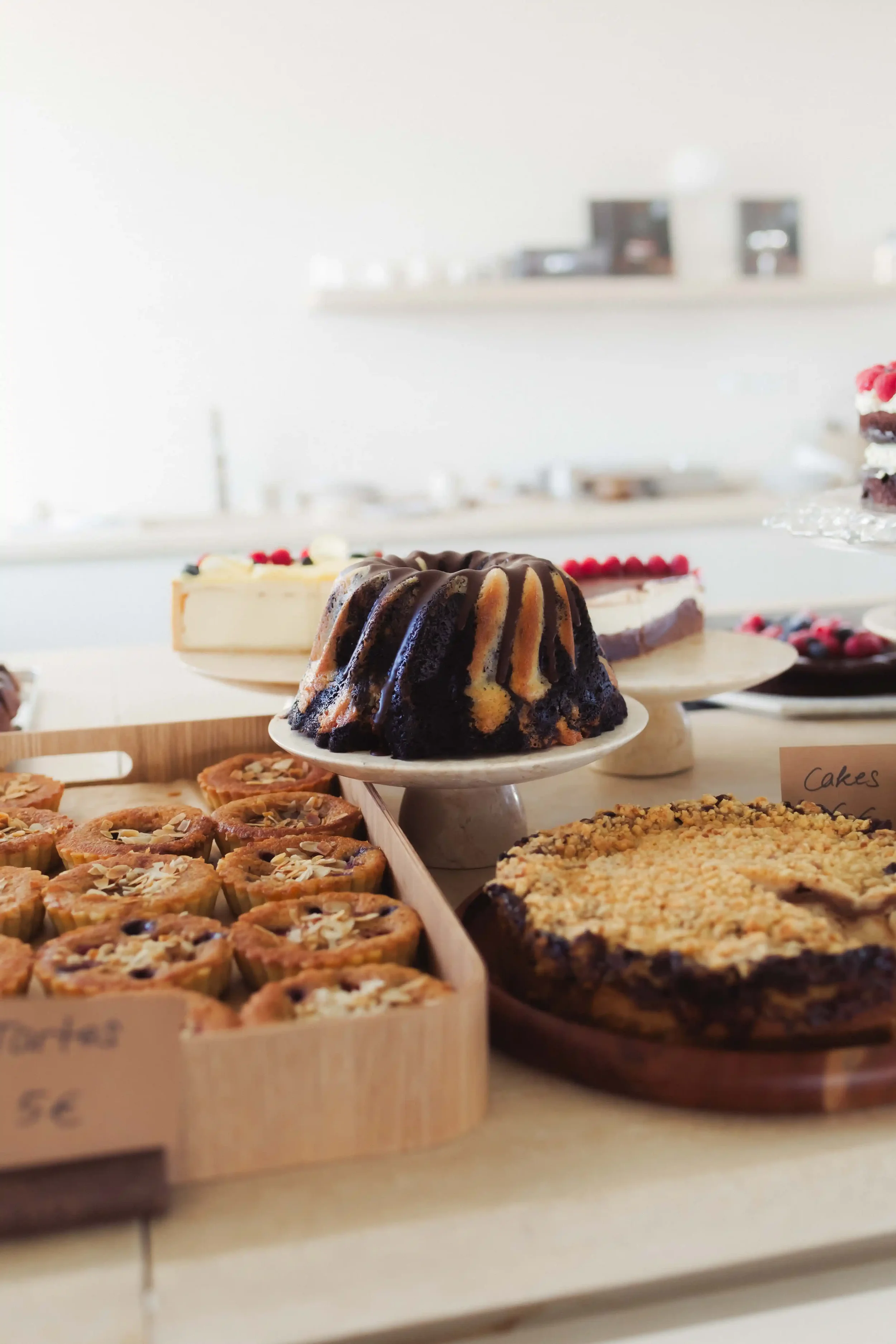 Artisan chocolate bundt cake and pastries presented at bakery pop-up event