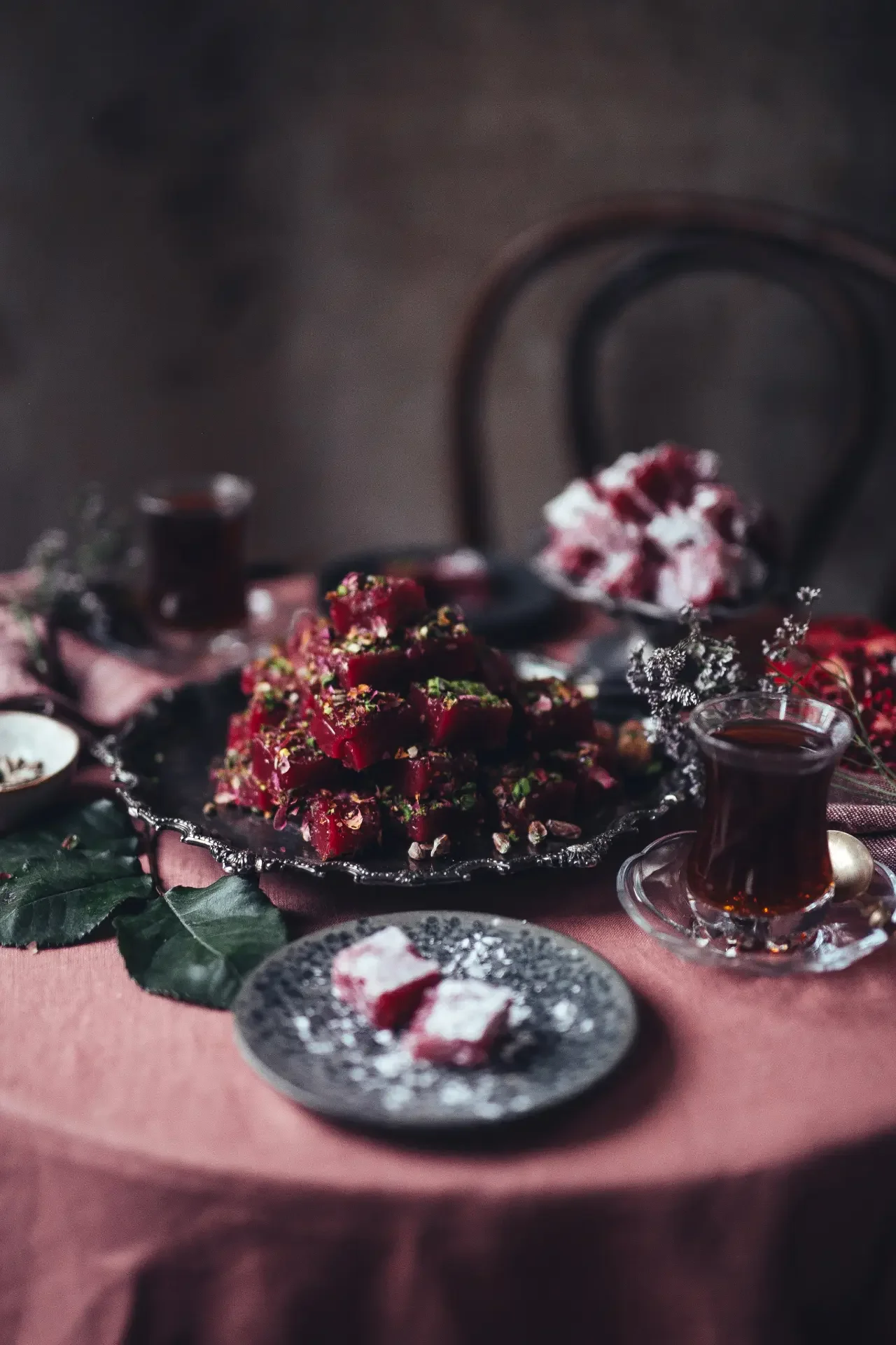 Traditional Turkish tea ceremony with lokum and dried rose decorations